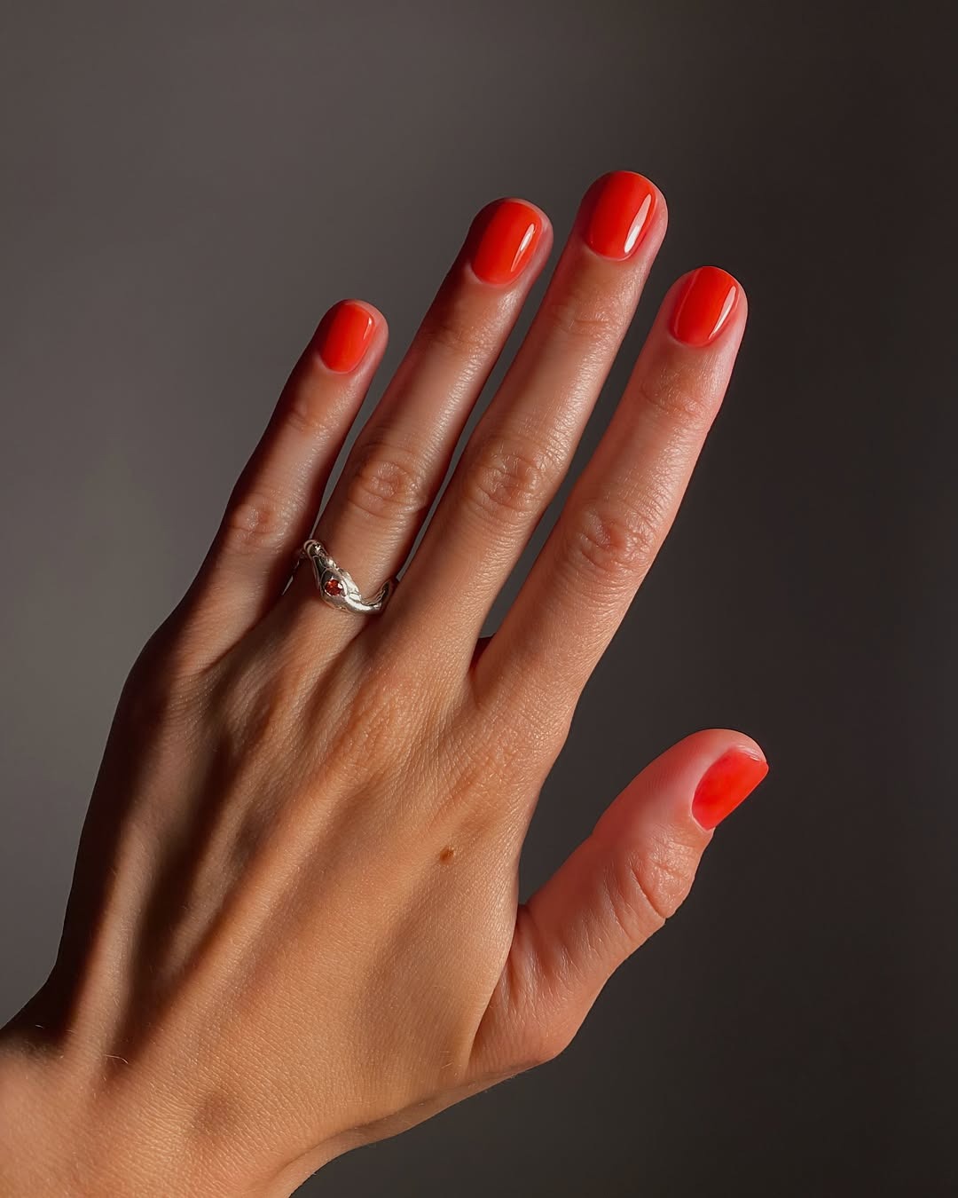 A sheer red manicure
