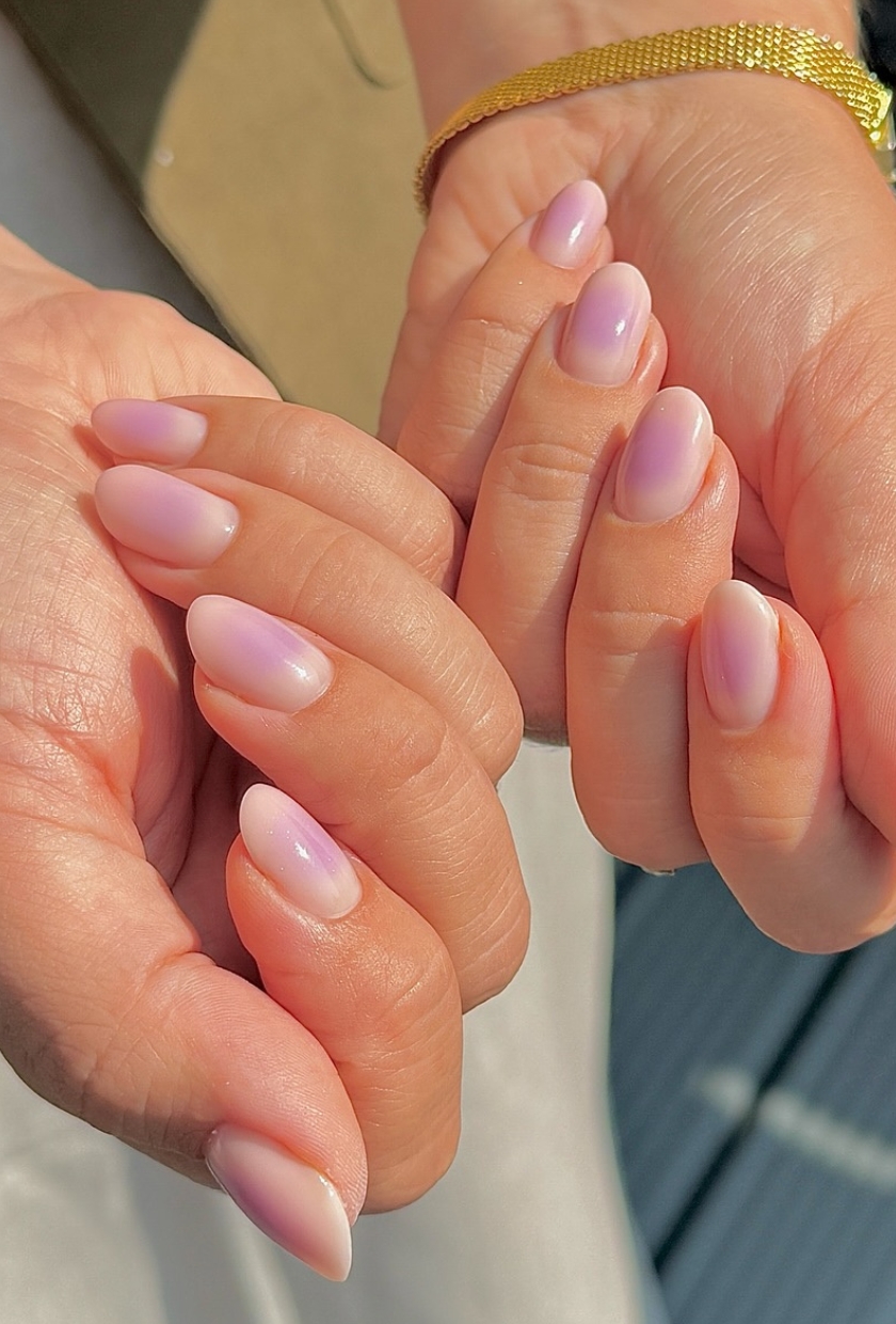 A close up shot of mauve milk aura nails