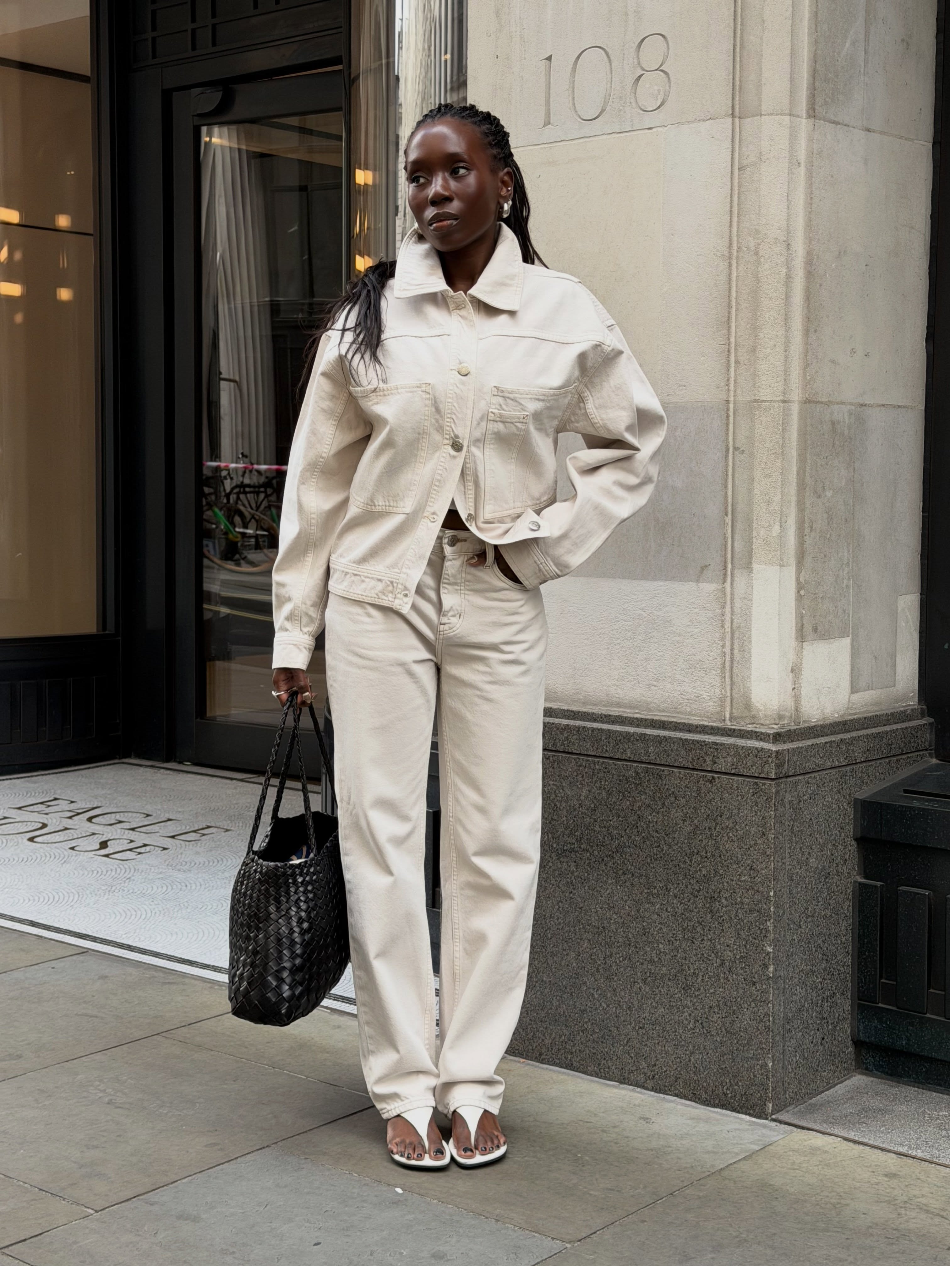 @daniellejinadu wearing a white denim Canadian tuxedo.