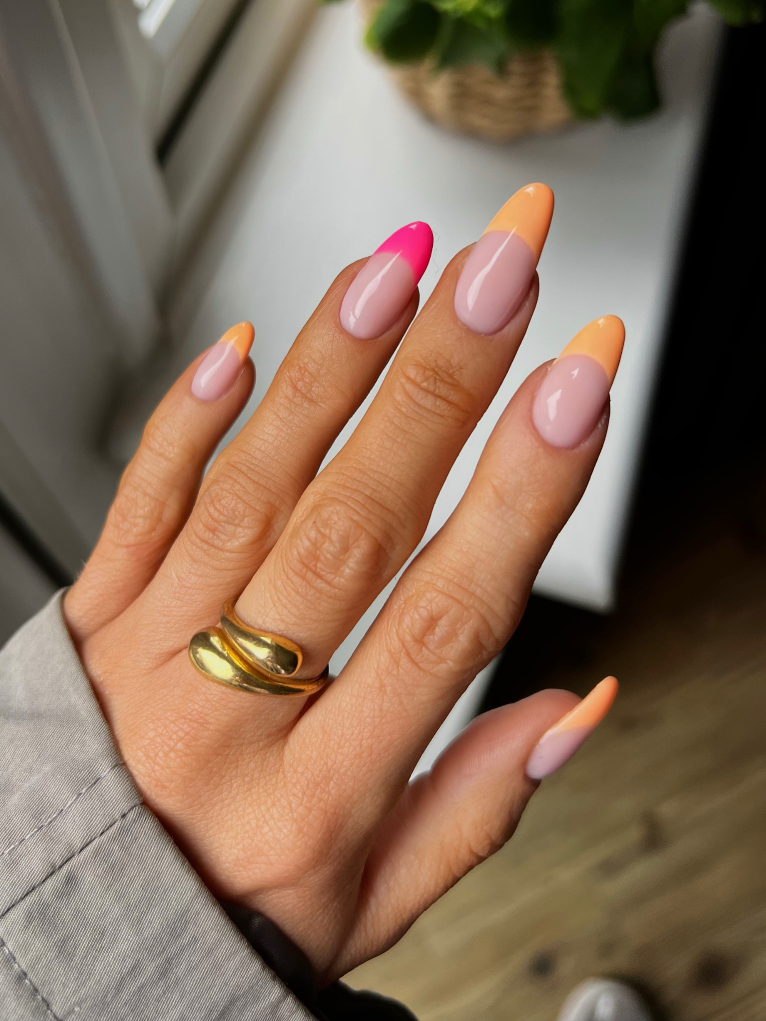 Pink and orange French tips.