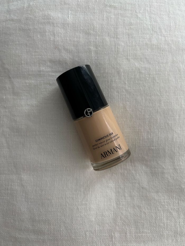 The Giorgio Armani Luminous Silk Foundation on a white linen background