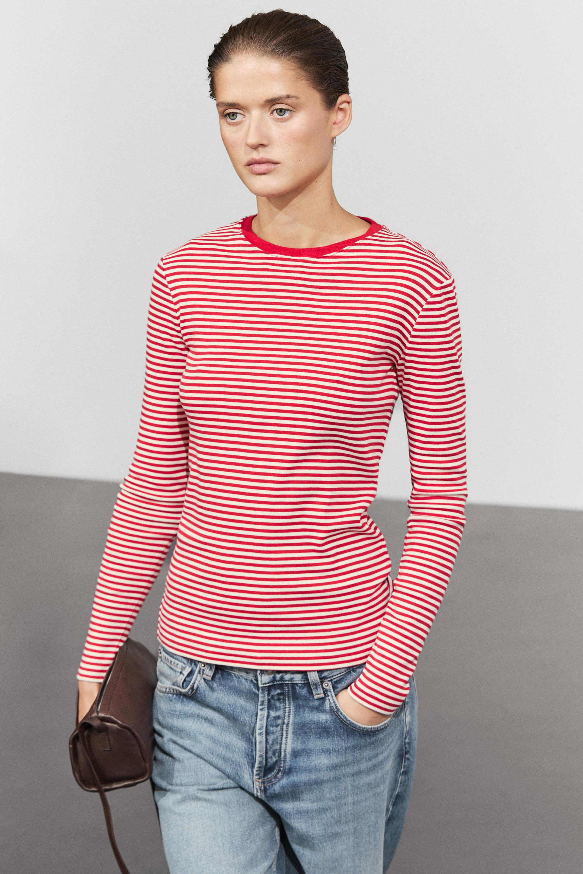 A model wearing a red striped Massimo Dutti t-shirt.