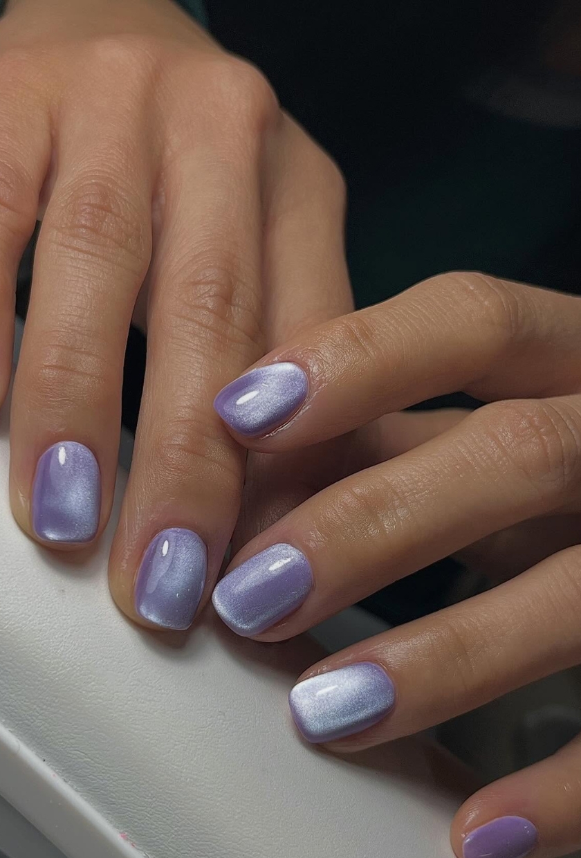 a close up shot of mauve milk cat-eye nails