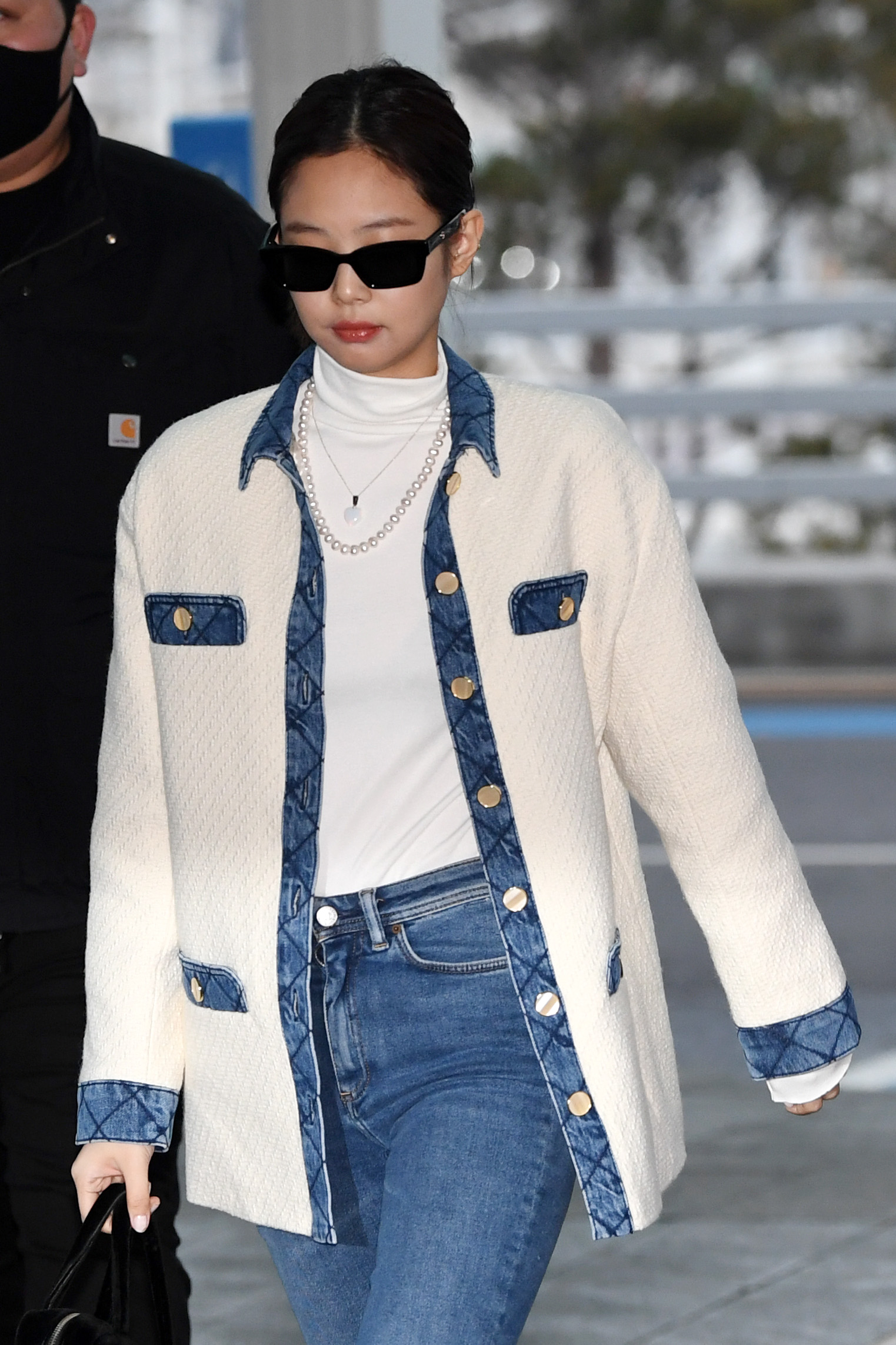 Jennie Kim wearing a denim outfit.