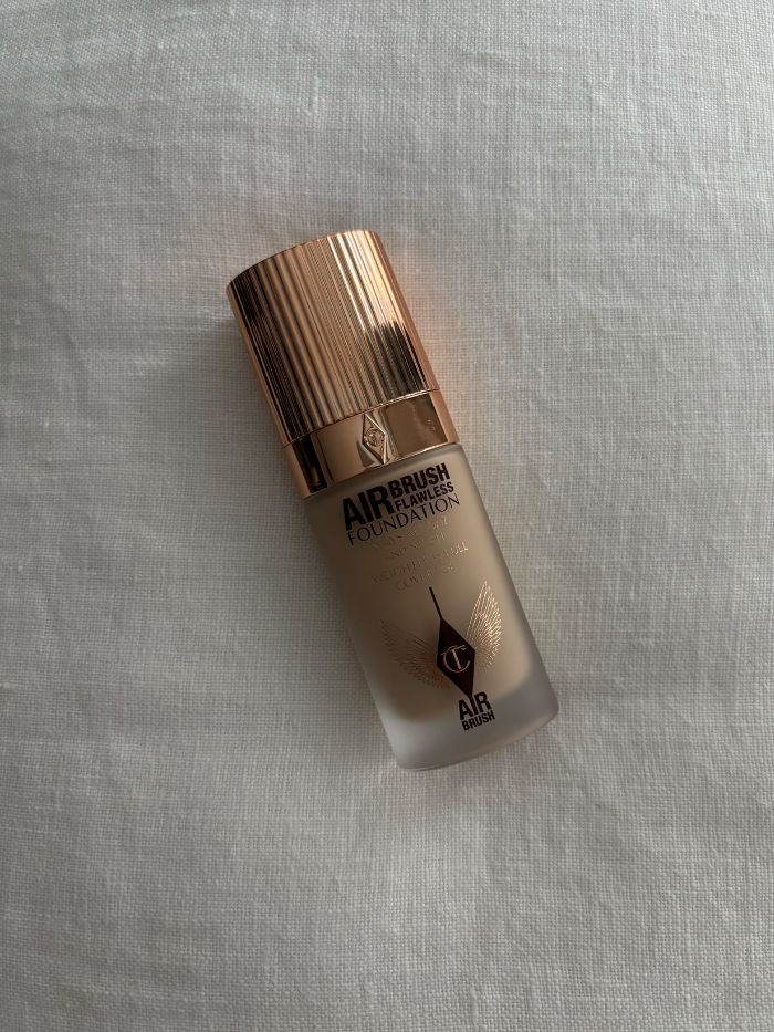 The Charlotte Tilbury Airbrush Flawless Foundation on a white linen background