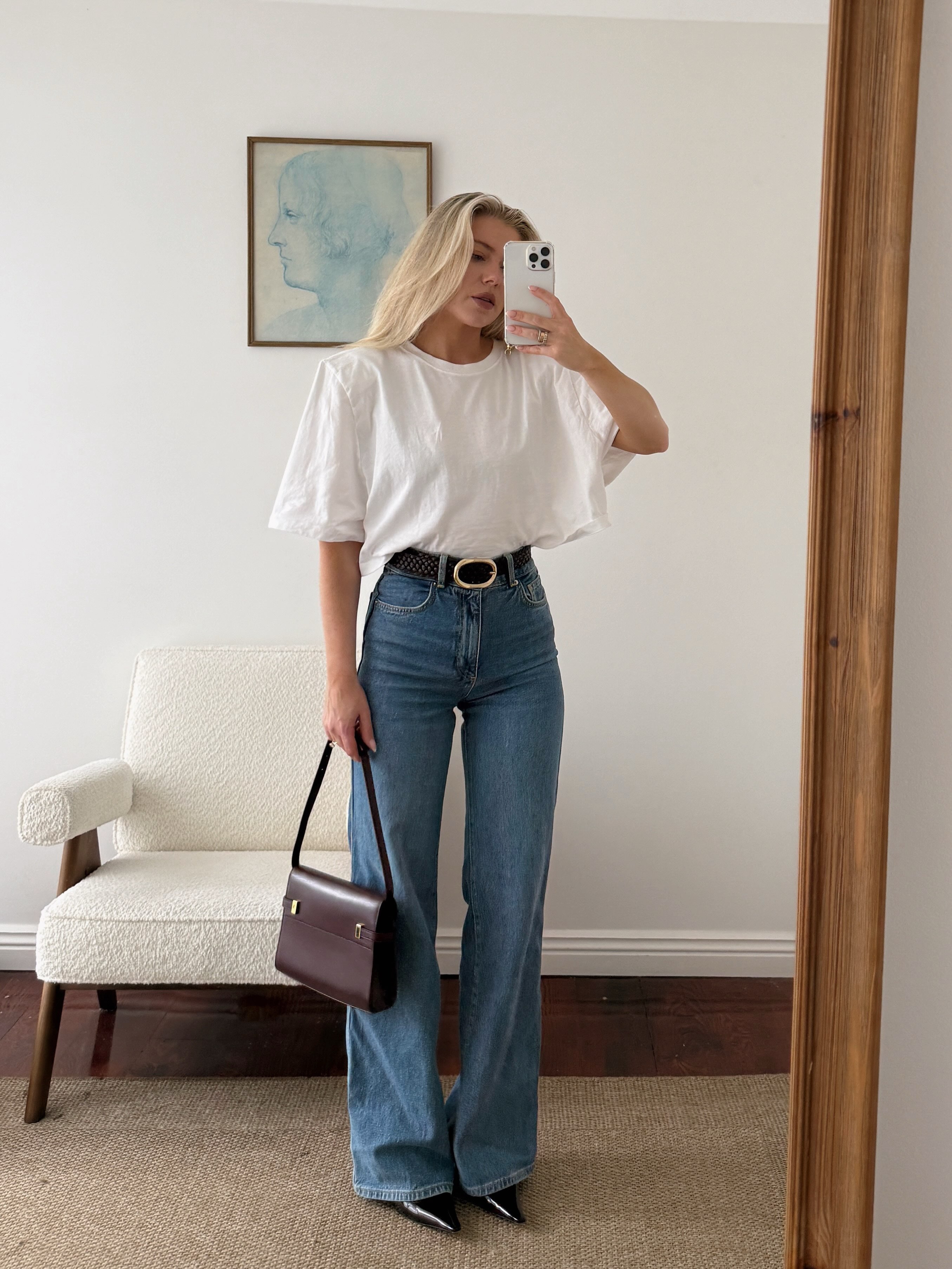 An image of a woman wearing fall boot trend with jeans 2026