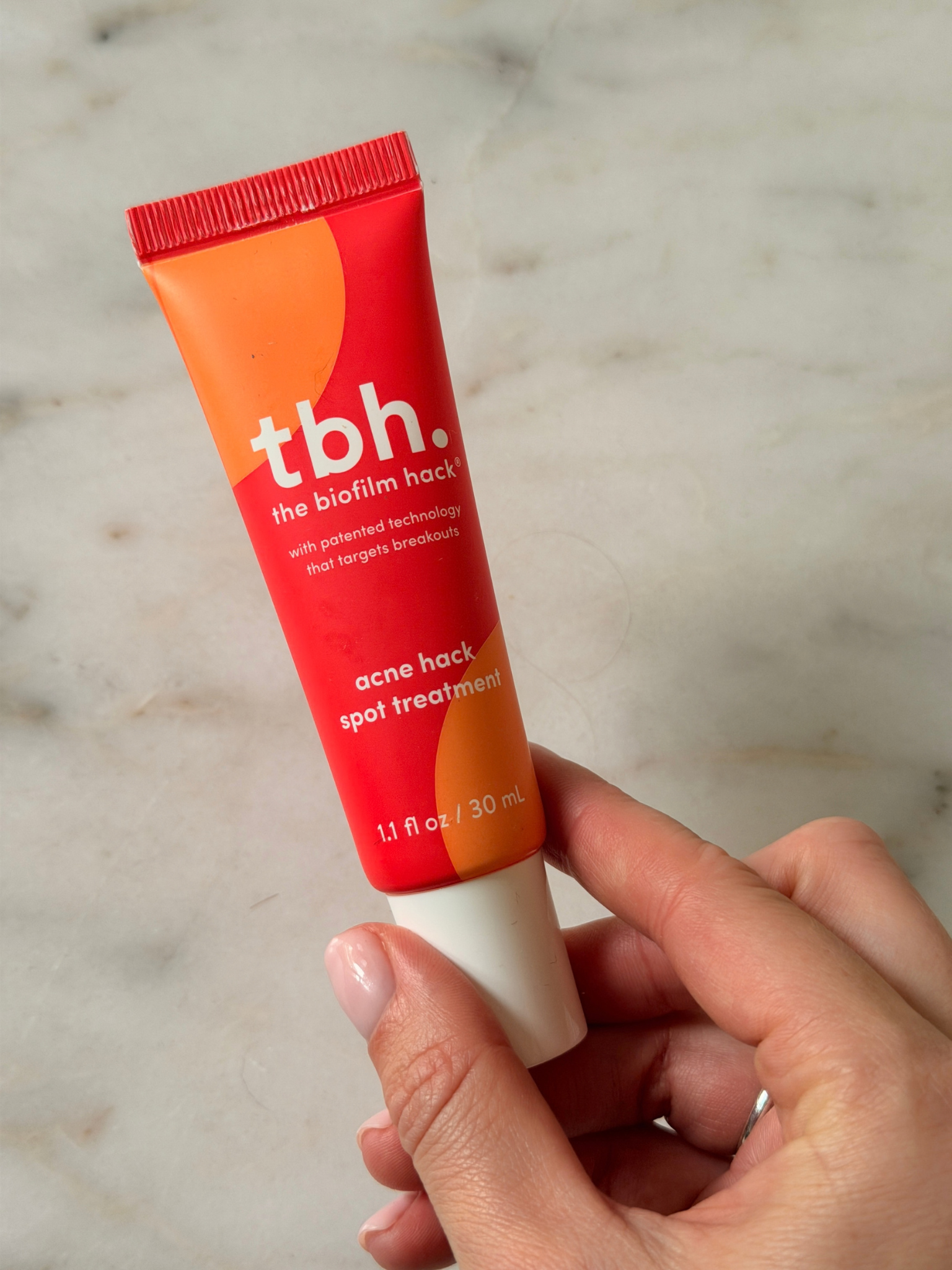 Freelance beauty editor Grace Day holding the TBH spot treatment
