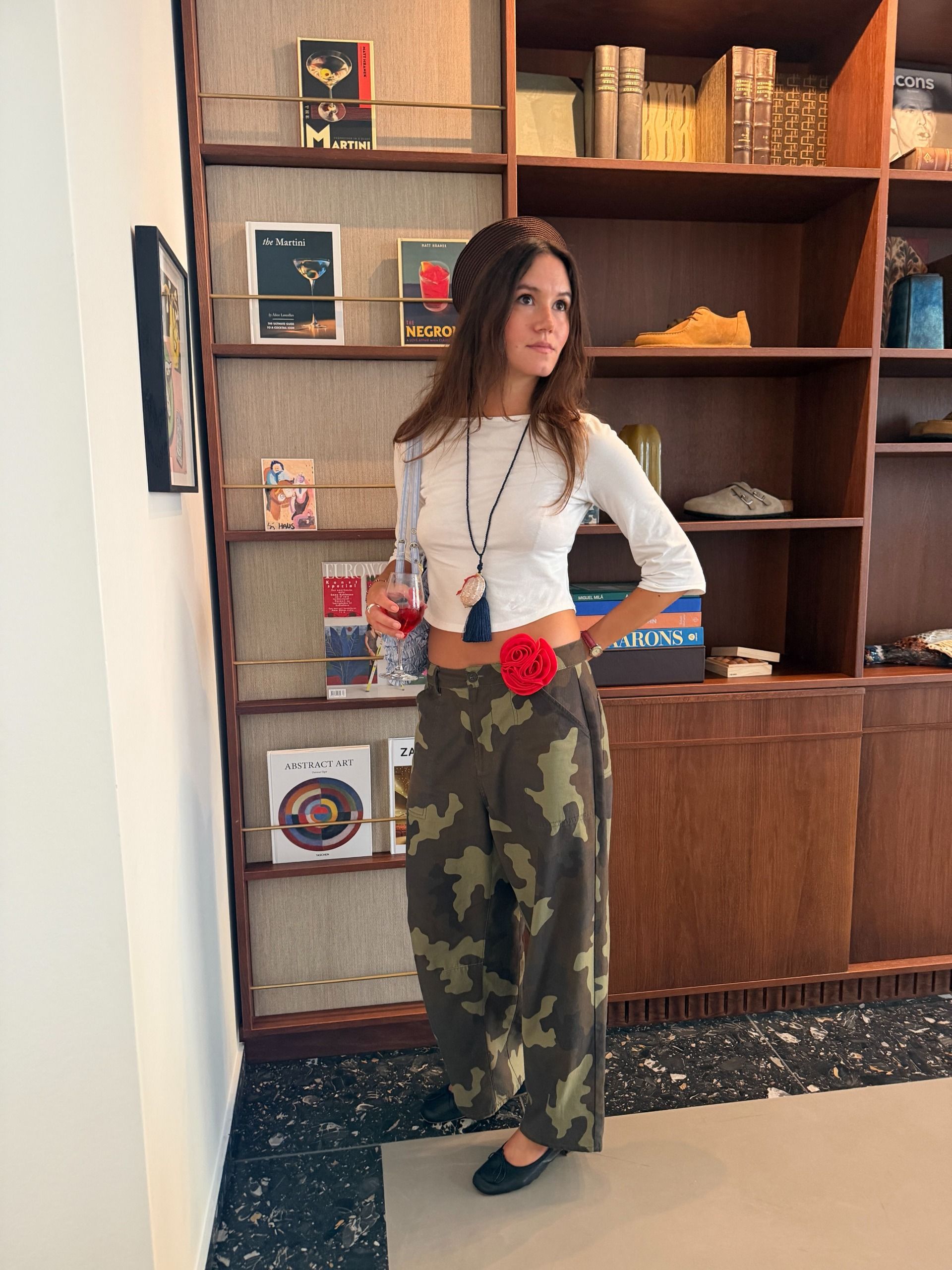 An image of a woman wearing best shoes to wear with camo pants fall 2026