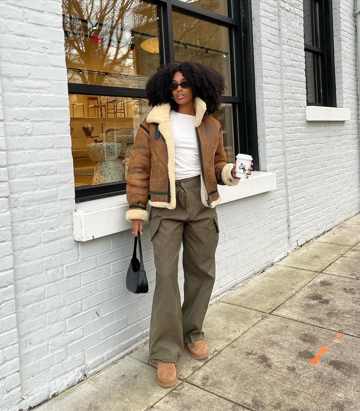 Khaki cargo trousers and aviator jacket.