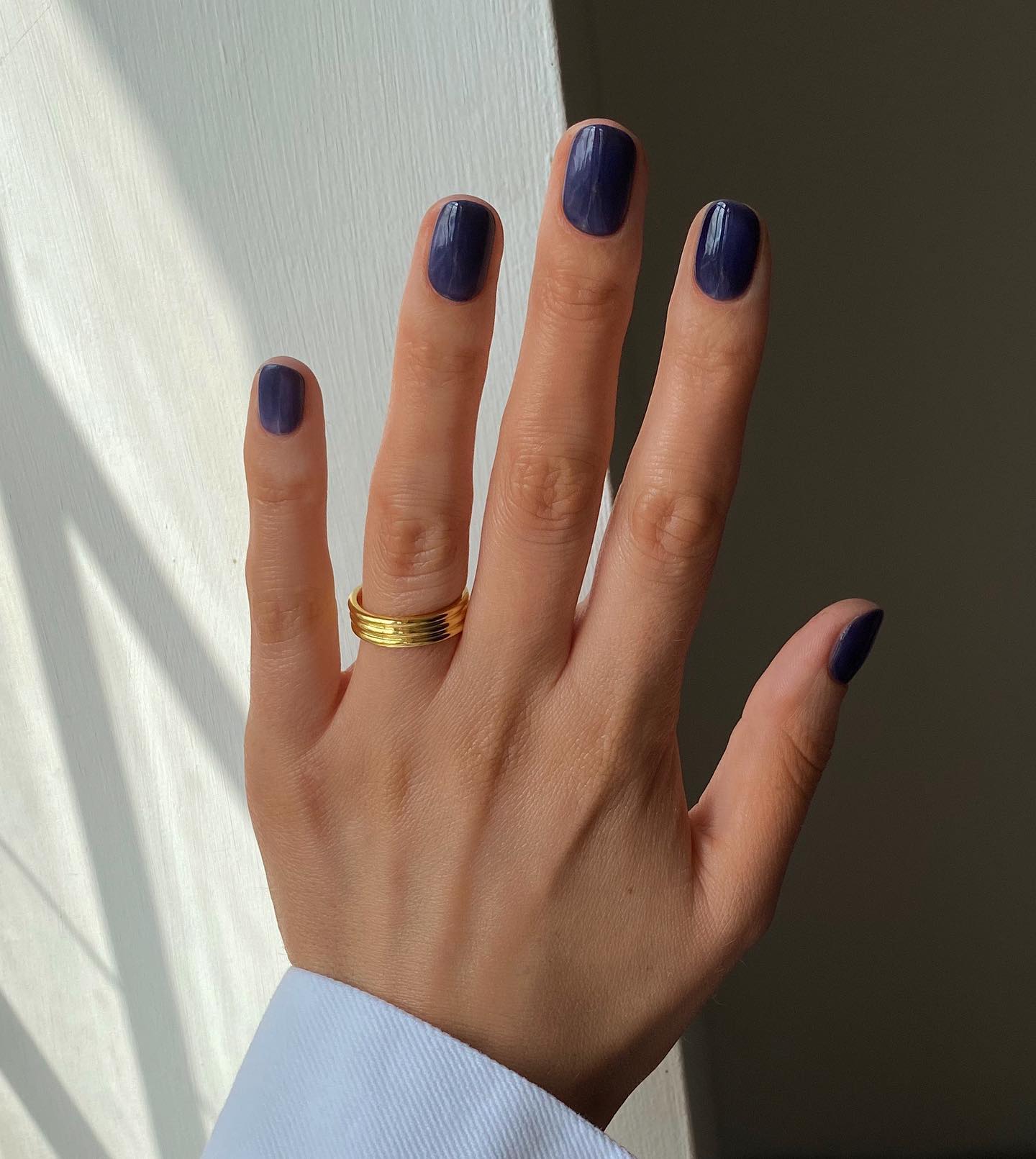 Photo of almost-black blue nails