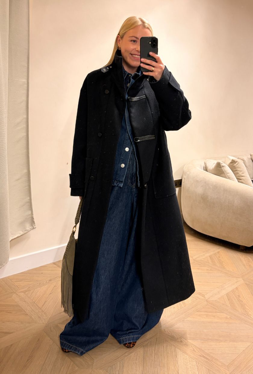 Woman wears wool coat, blue denim co-ord