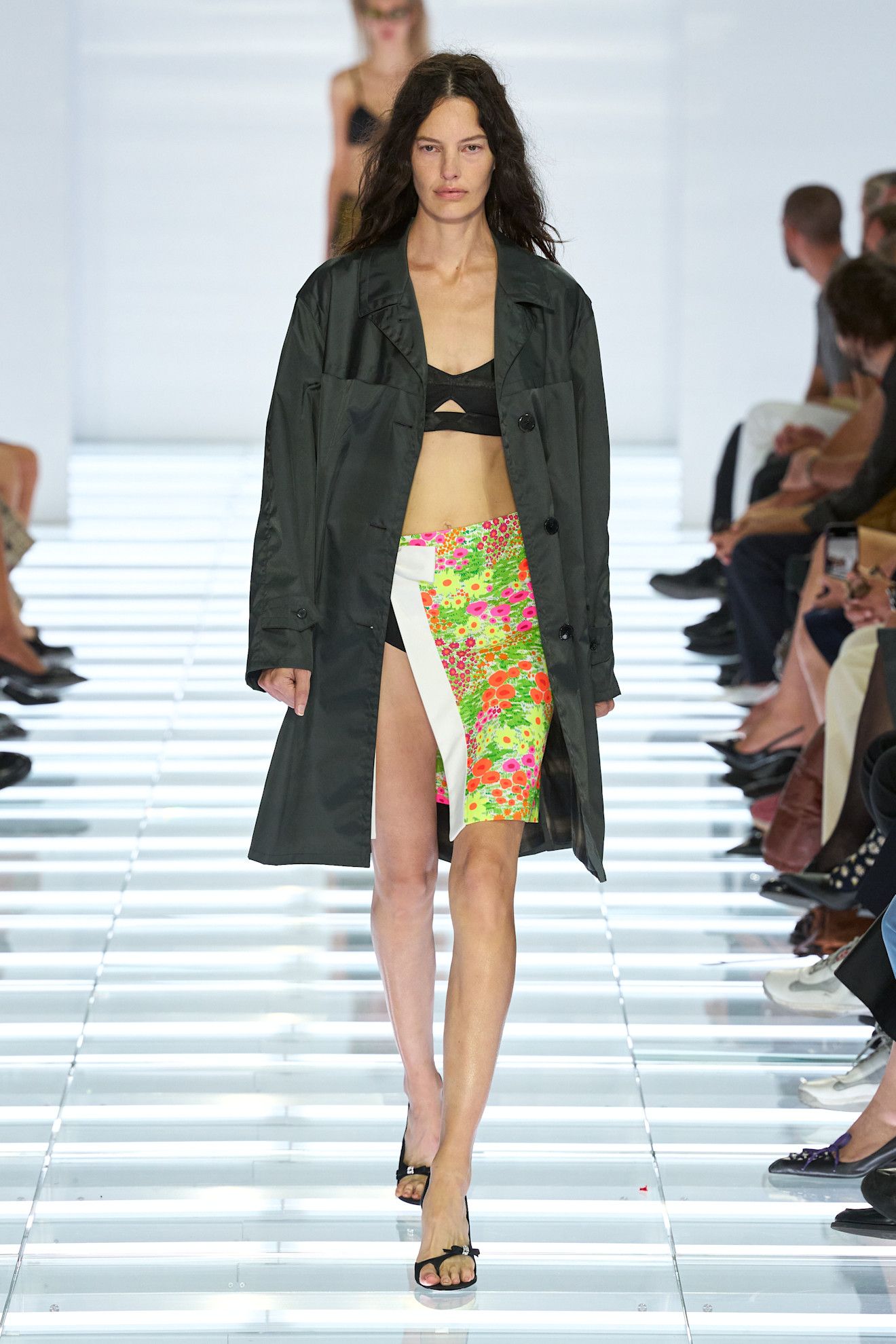 A model walking in a bralette and skirt at the S/S 27 Milan Fashion Week Prada show.