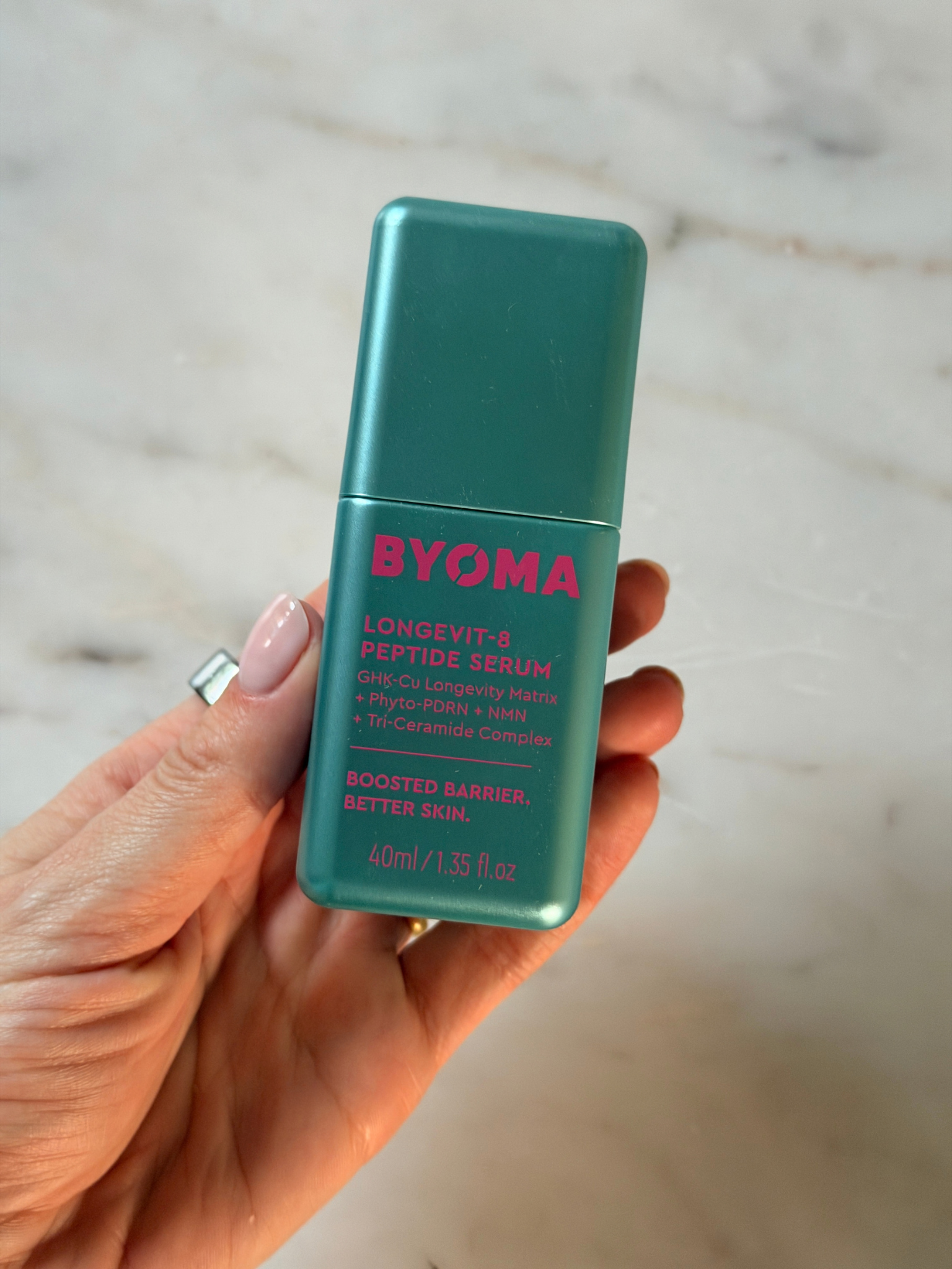 Freelance beauty editor Grace Day holding the Byoma serum
