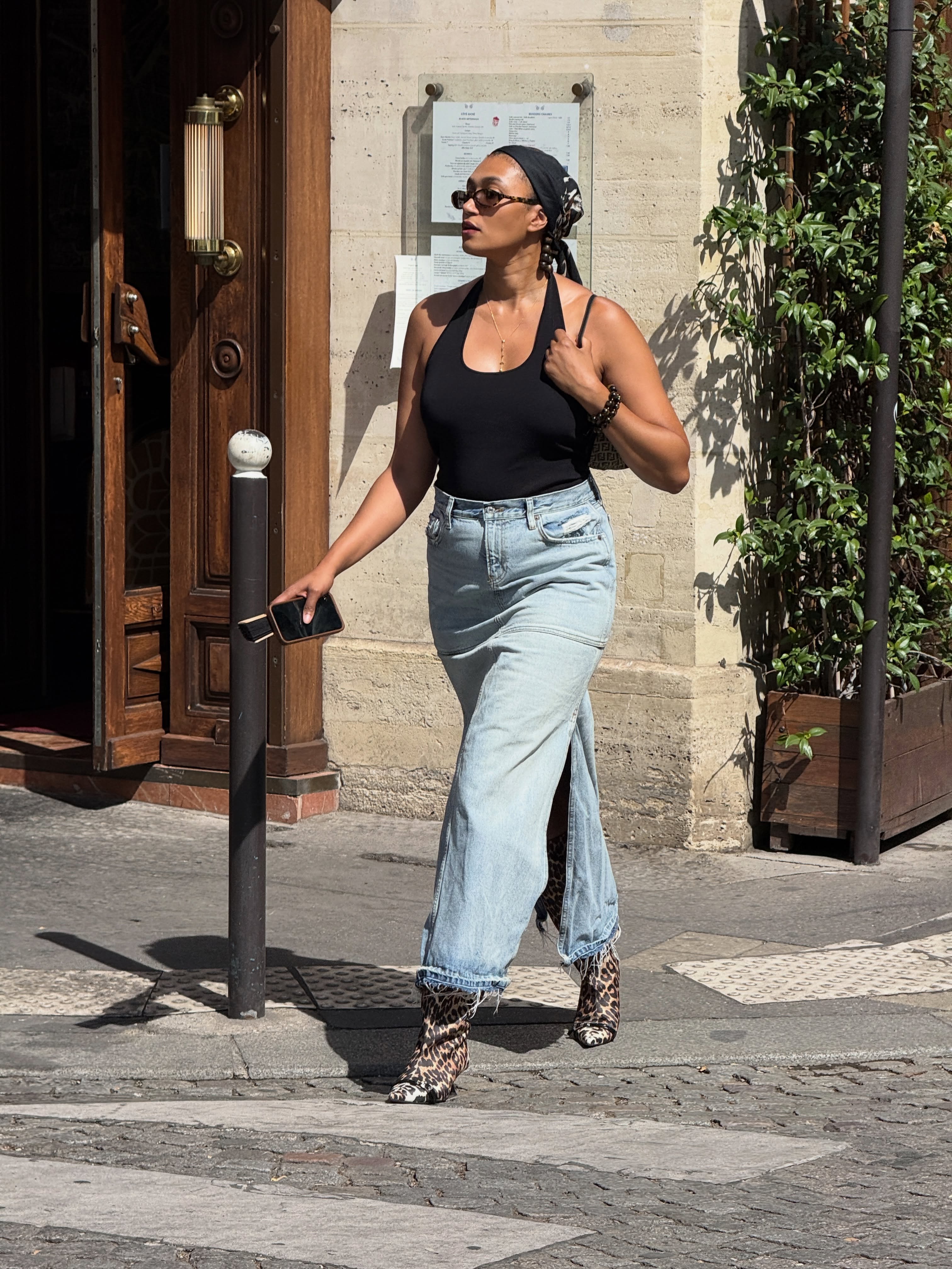 An image of a woman wearing fall boot trend with jeans 2026