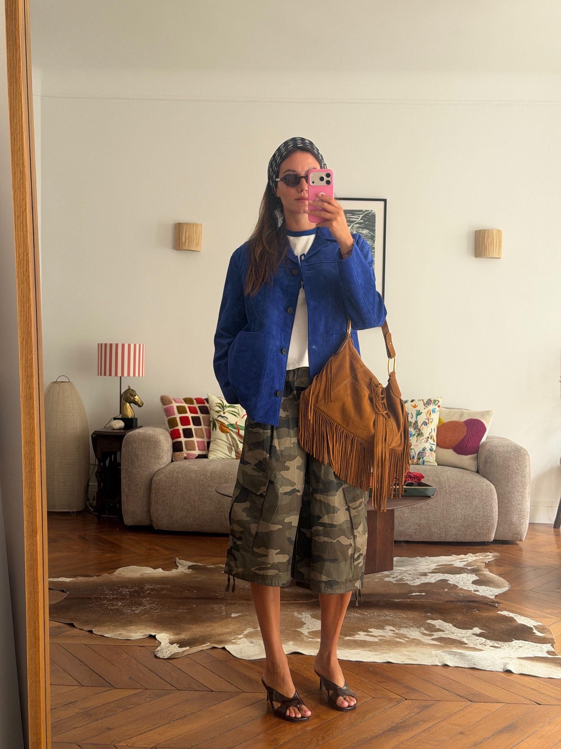 A woman wearing a camo-pant outfit in 2026.