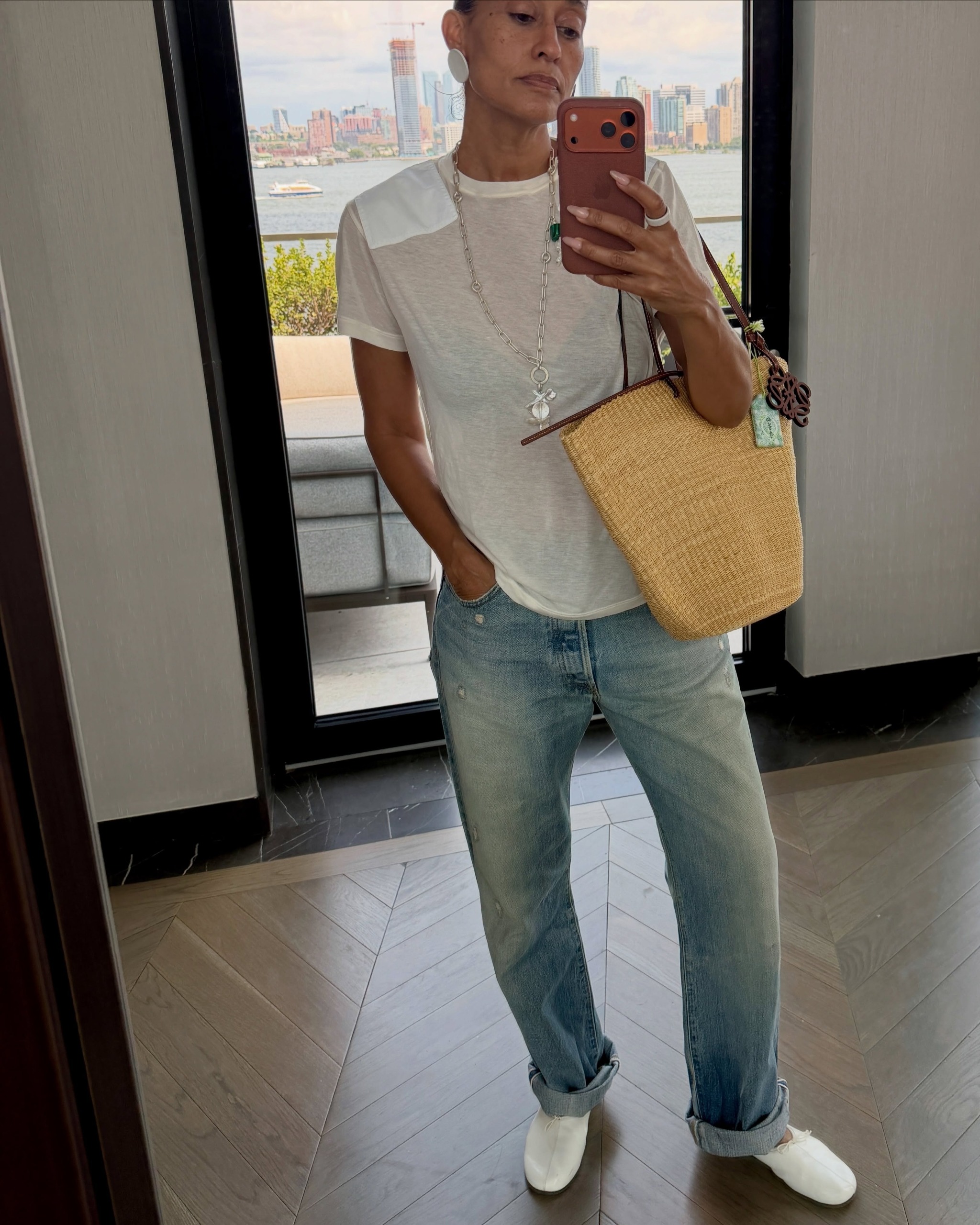 Tracee Ellis Ross wears high-vamp flat shoes with jeans and cropped trousers.