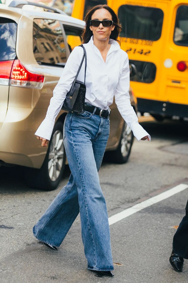 Woman in NYFW street style denim outfit.