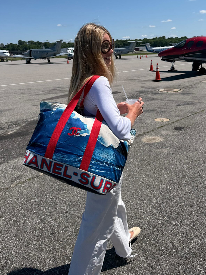 Woman wearing a business-class travel outfit.
