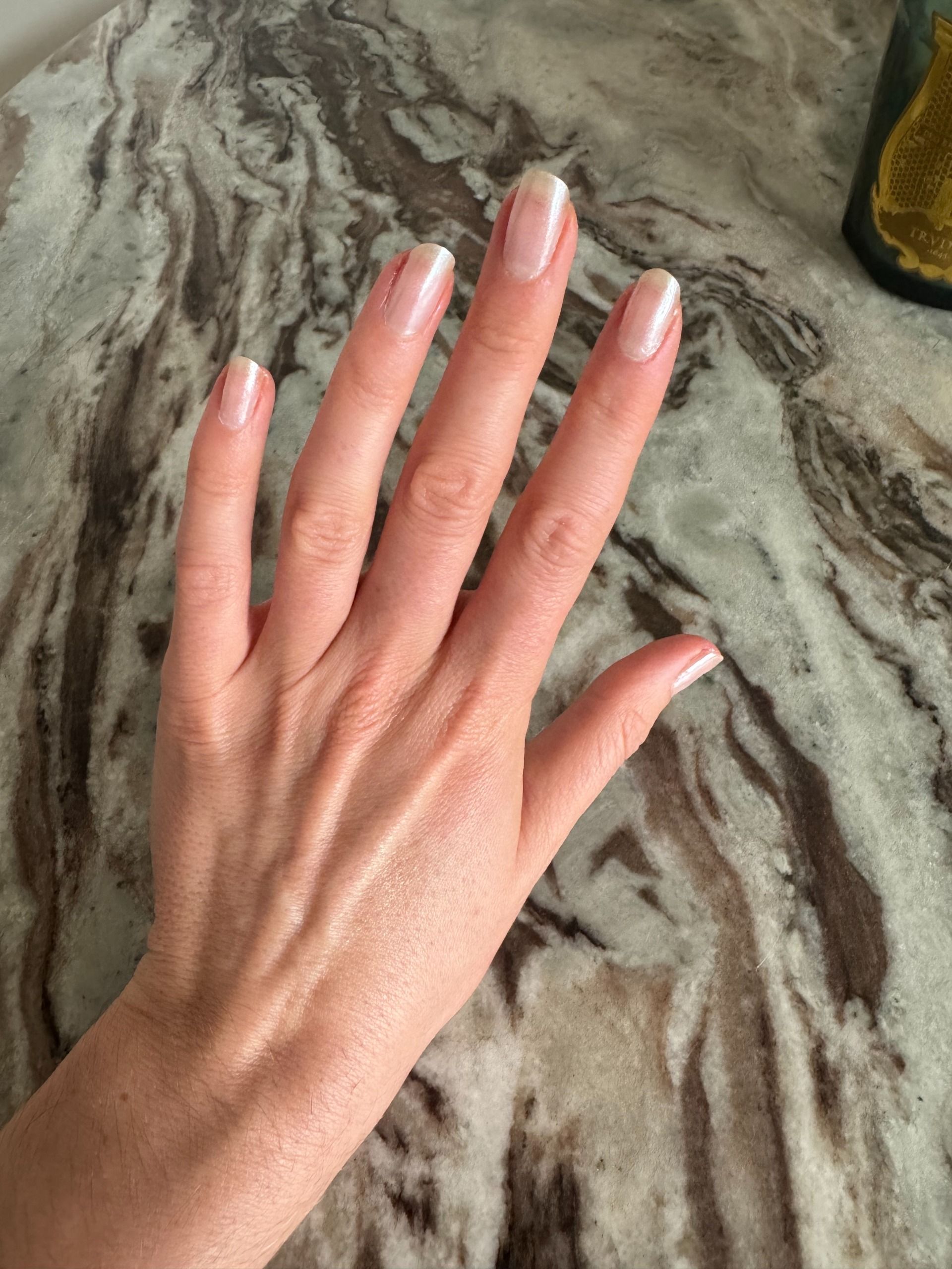 Beauty editor Eleanor Vousden testing Manucurist White Glazed Powder on her nails