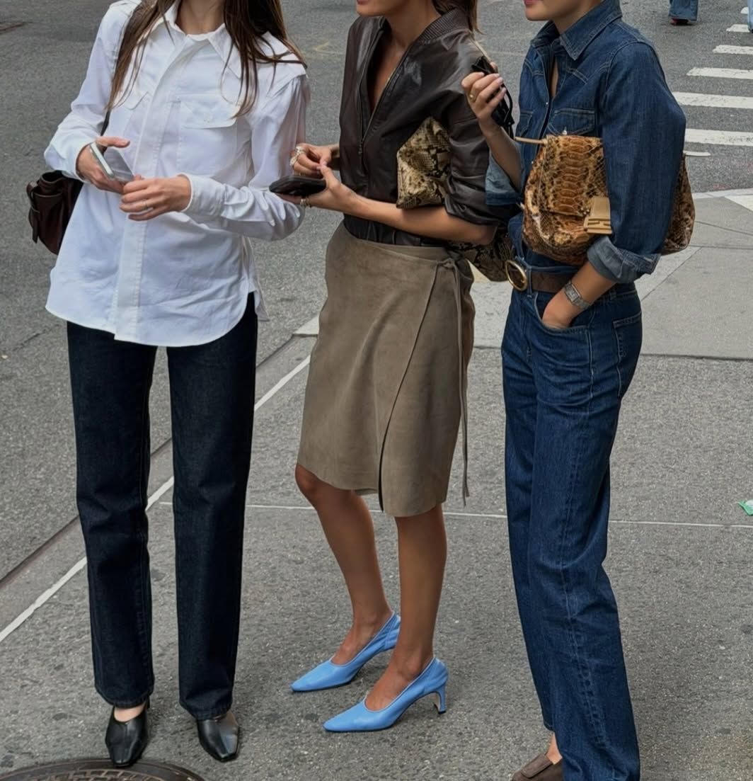 An image of three women in New York wearing various autumn outfits and autumn trends, including tuxedo shirts.