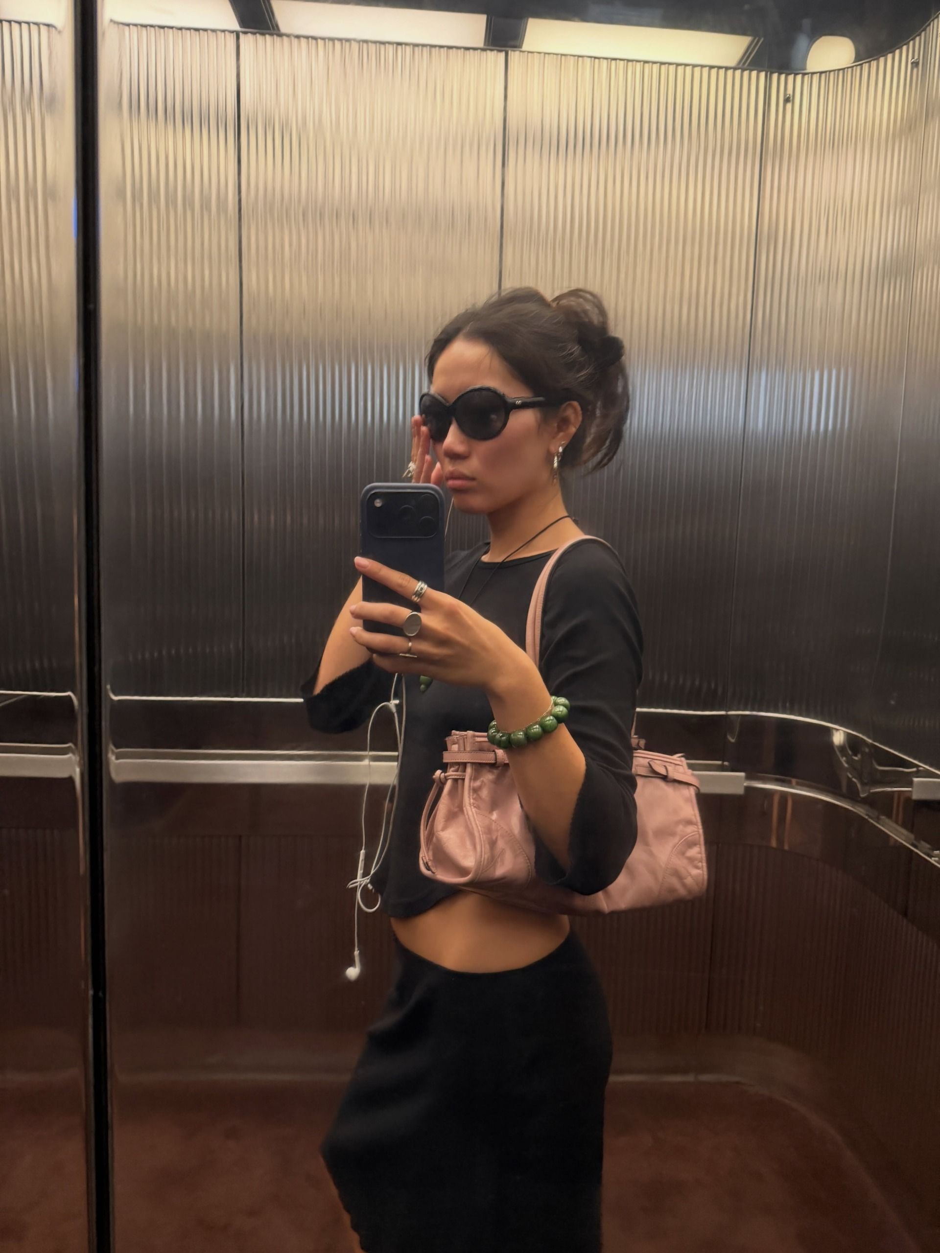 Woman in a black boat neck top