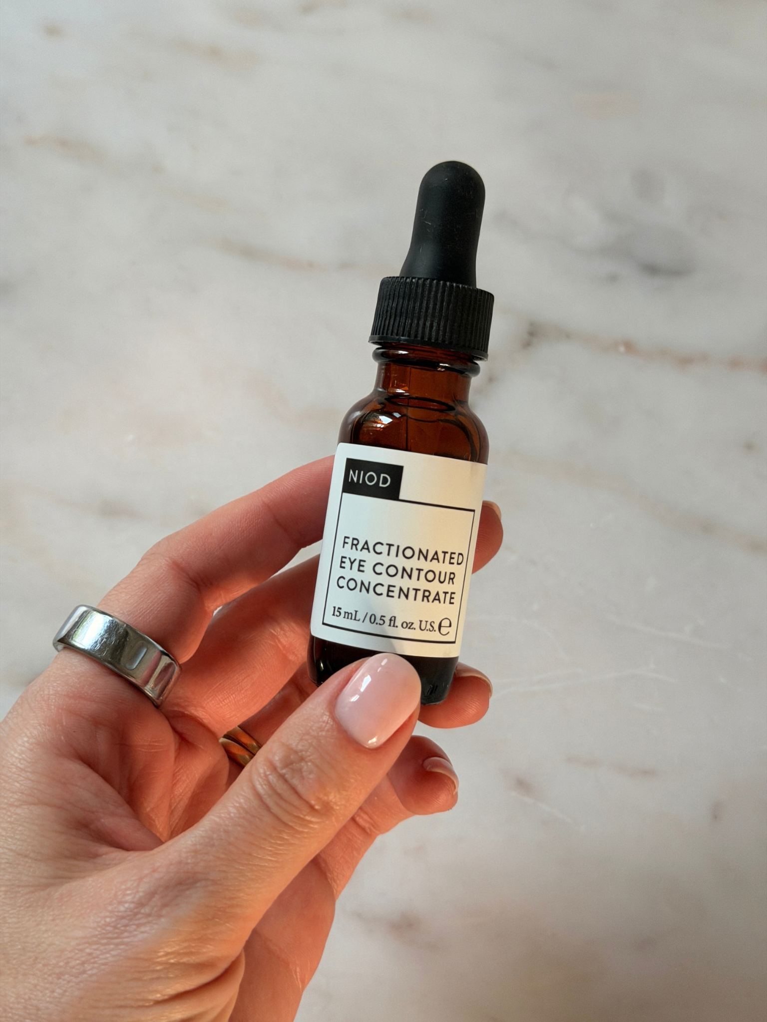 Freelance beauty editor Grace Day holding the NIOD eye serum