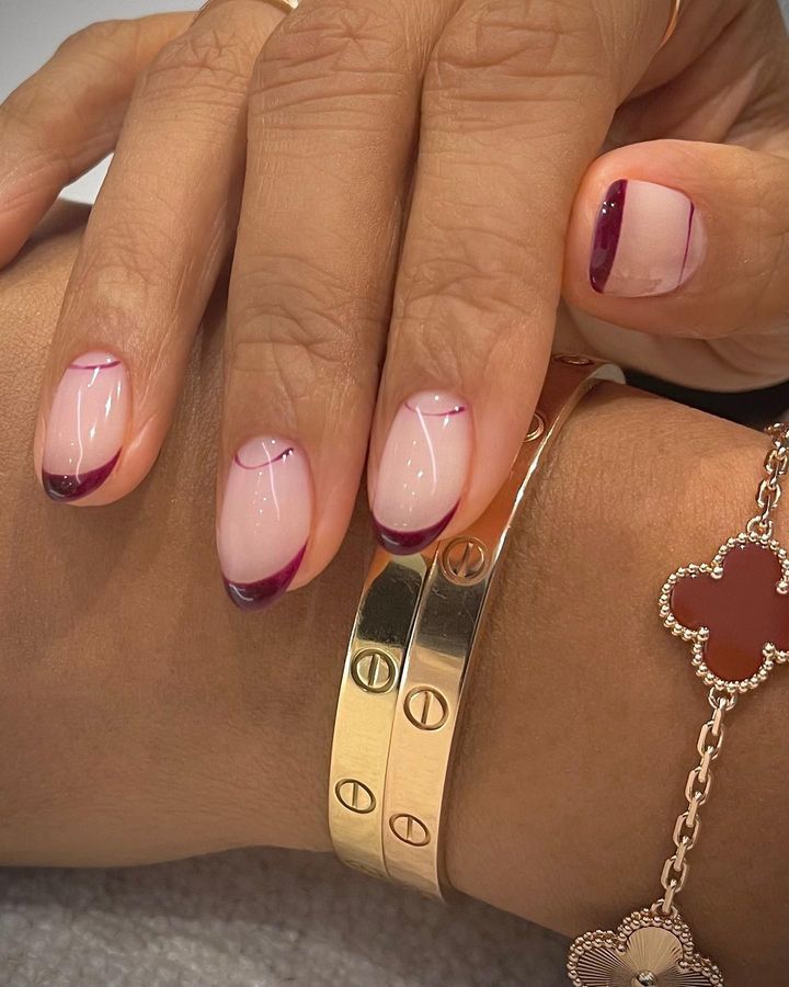 Dark red French manicure with a reverse French at the base of the nails