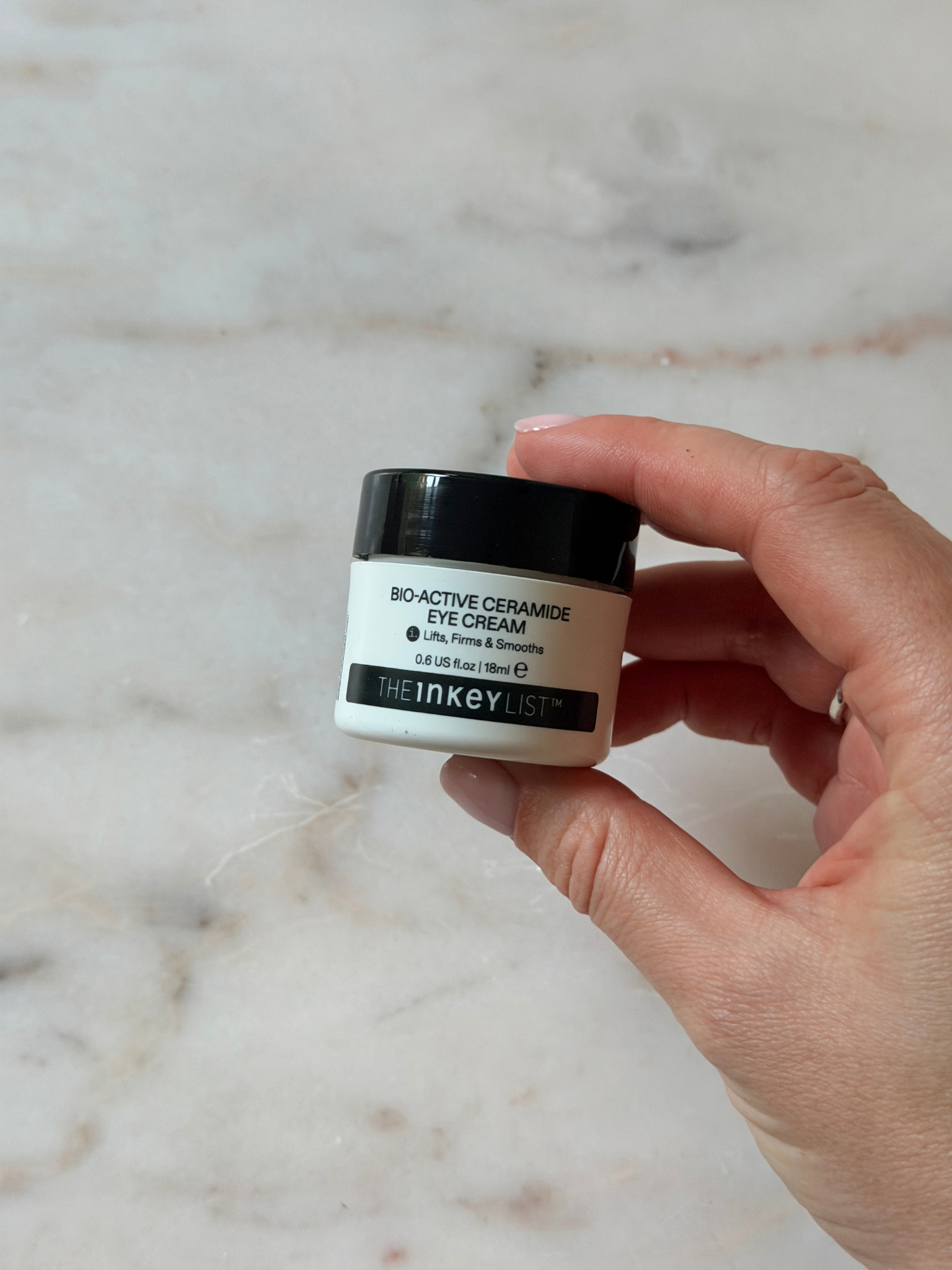 Freelance beauty editor Grace Day holding the Inkey List eye cream