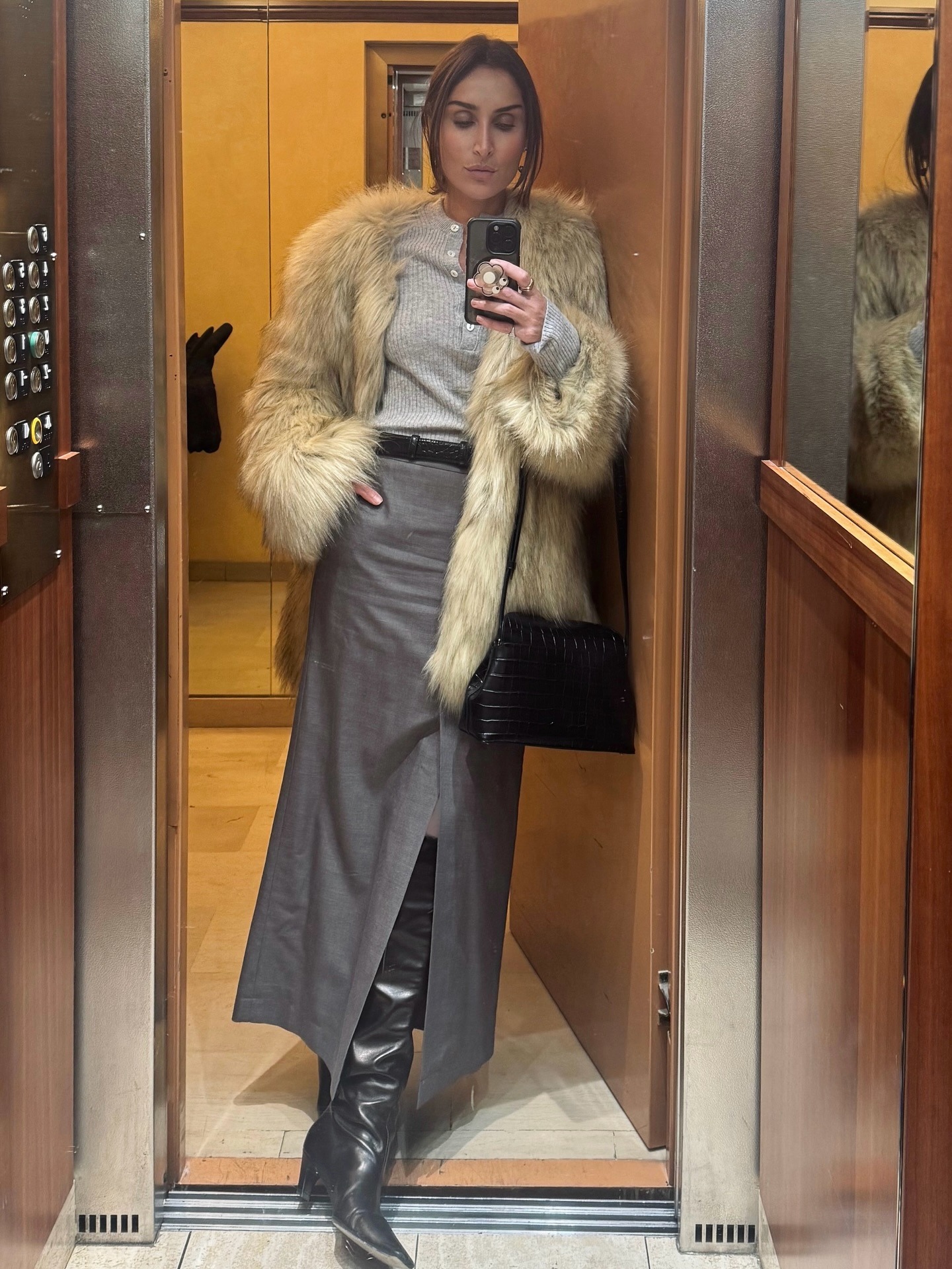 Influencer wearing fall 2026 shoe trend: slouchy boots