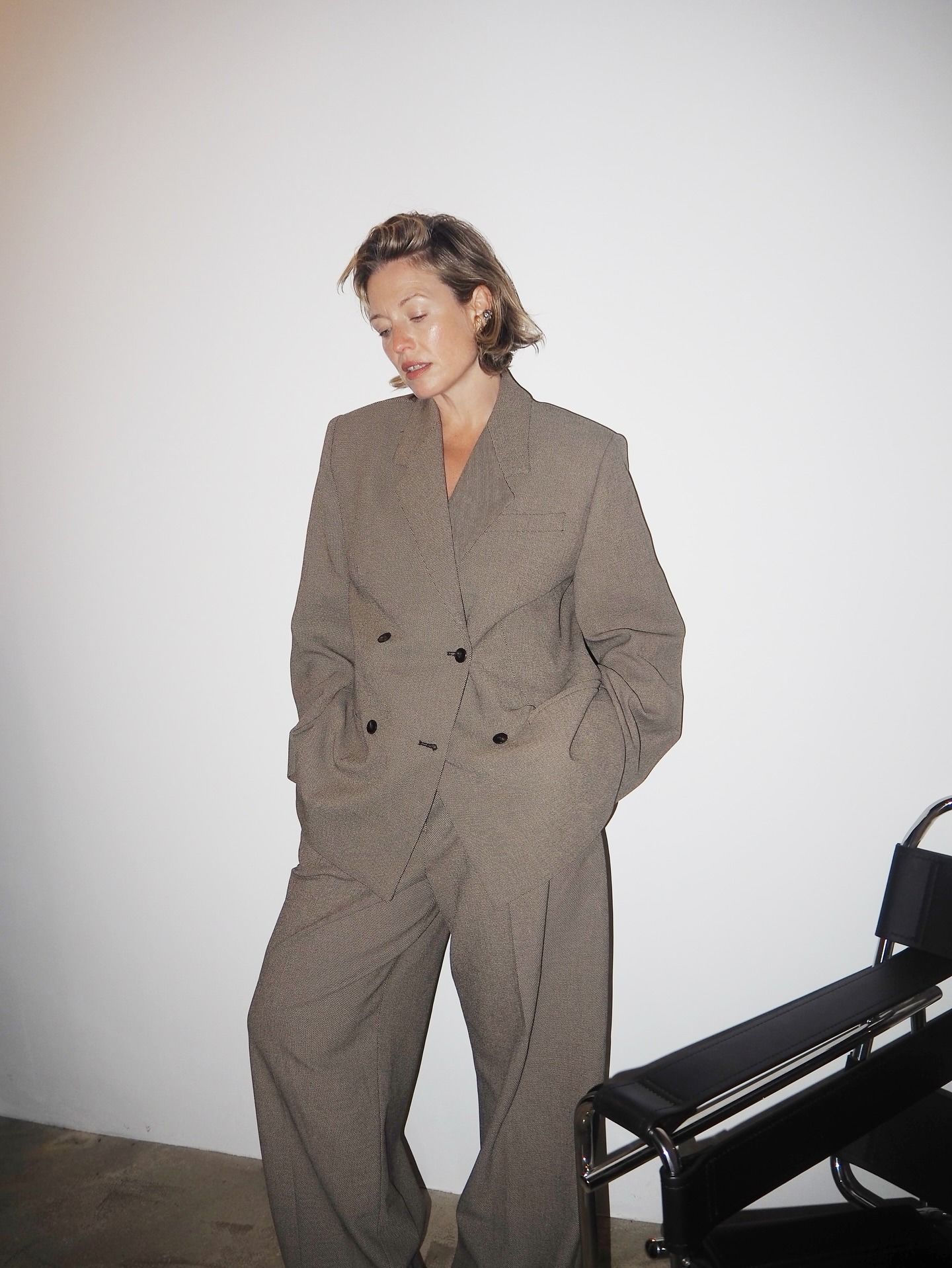 Woman wears suit from By Malene Birger