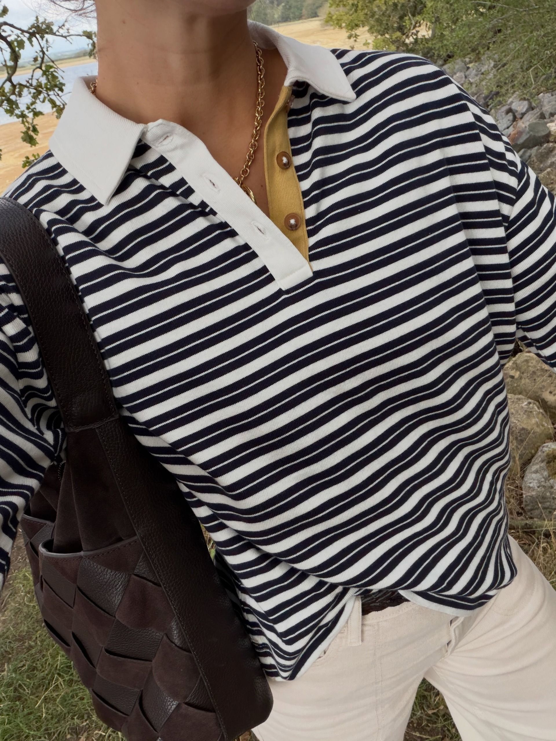 Influencer Rosie Ann Butcher wearing a striped rugby shirt.