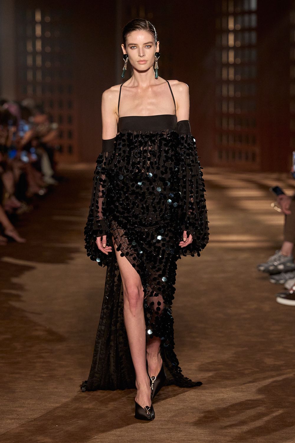 a model walks the ferragamo spring 2027 runway.