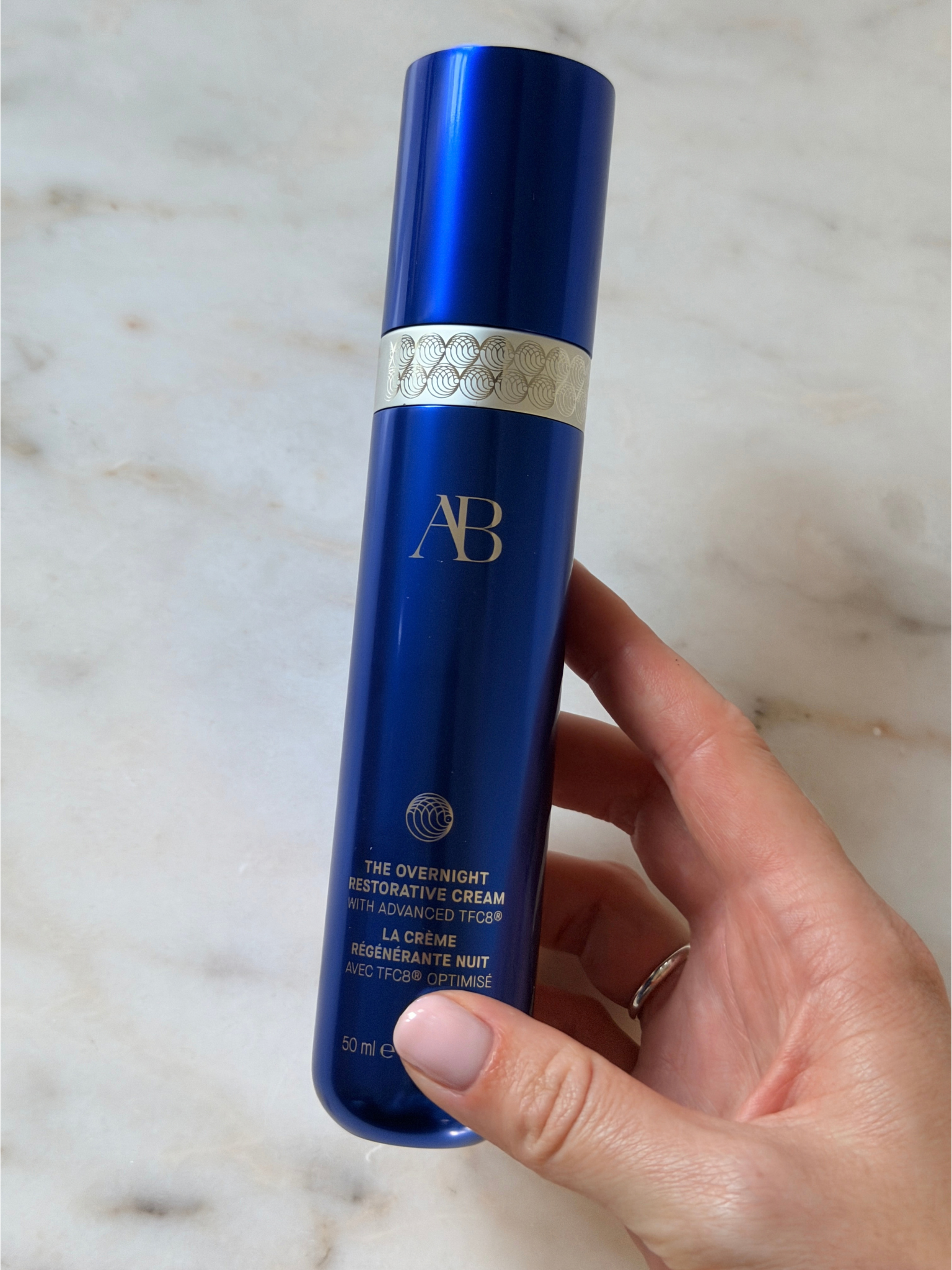 Freelance beauty editor Grace Day holding the Augustinus Bader moisturiser