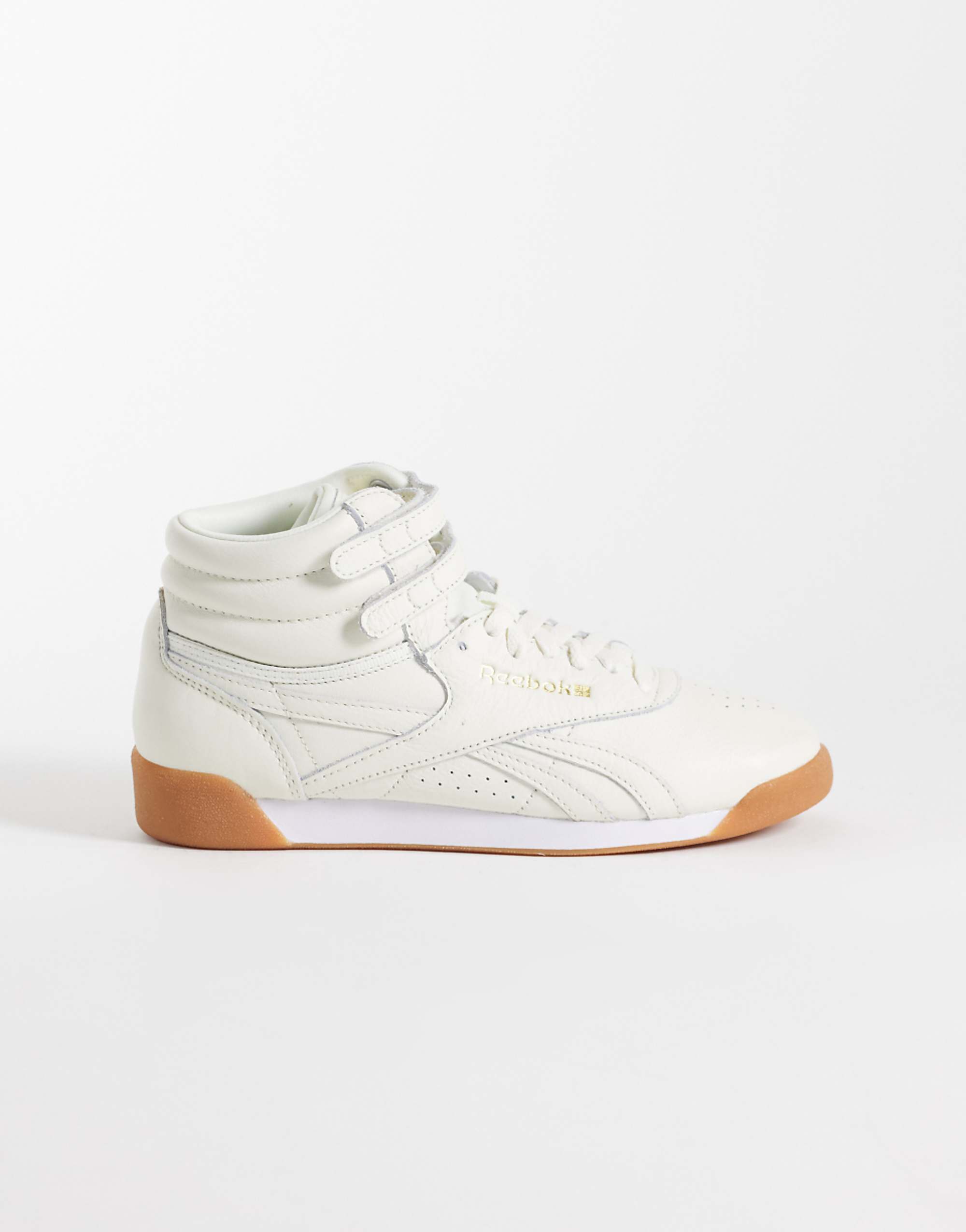 Reebok Freestyle Hi Trainers in White With Gum Sole