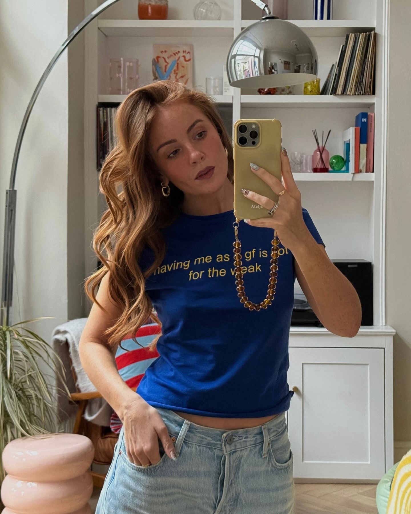 Creator @rebeccaferrazwyatt taking a mirror selfie with wavy marmalade blonde hair