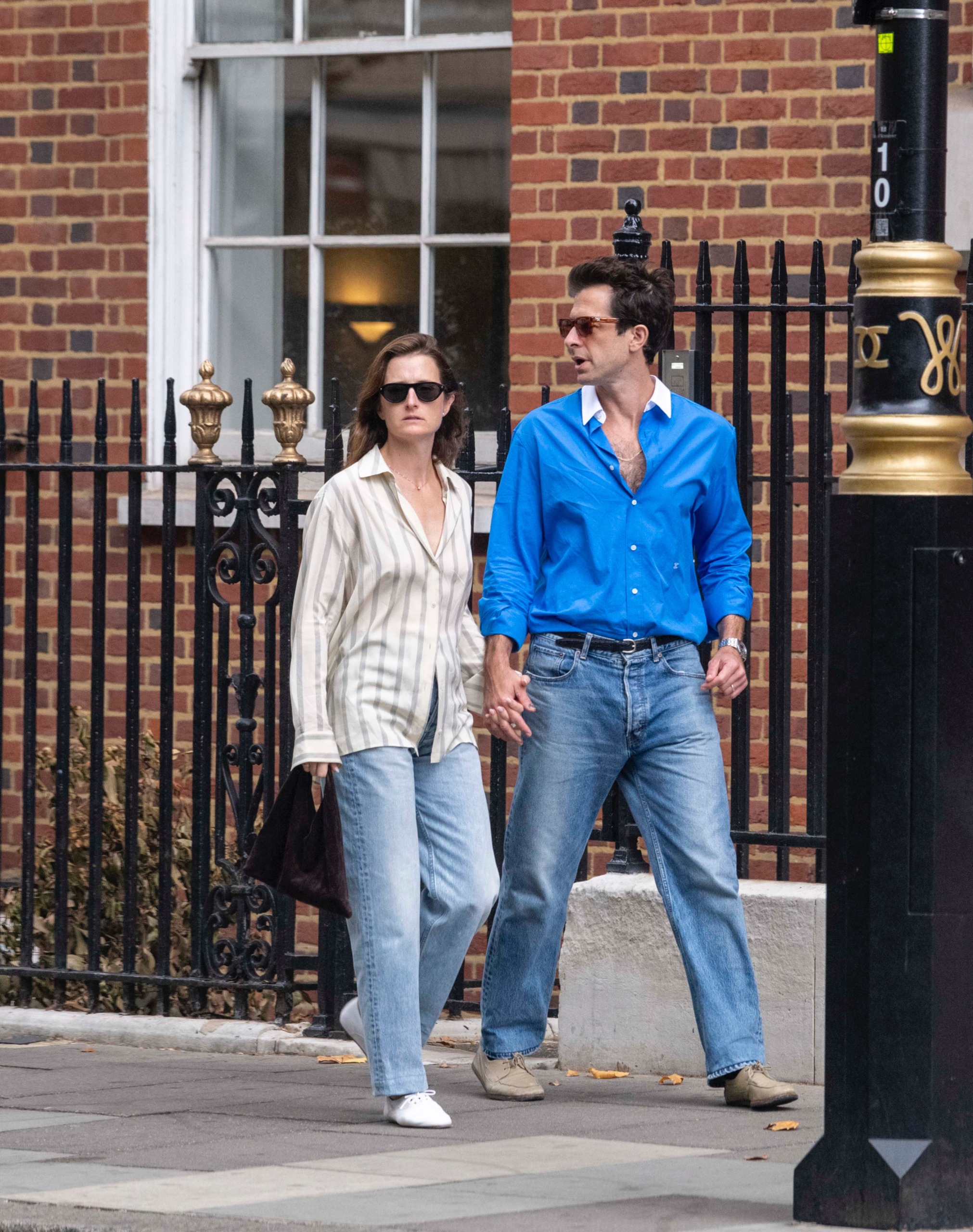 Grammy-winning music producer Mark Ronson was spotted enjoying a relaxed London stroll hand in hand with his wife, actress Grace Gummer.