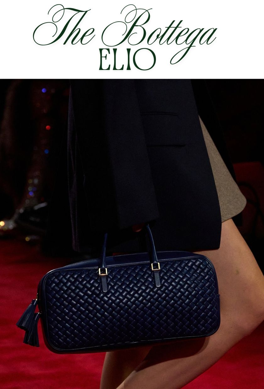 autumn winter it bags 2026: model carries a navy blue bottega veneta Elio bag