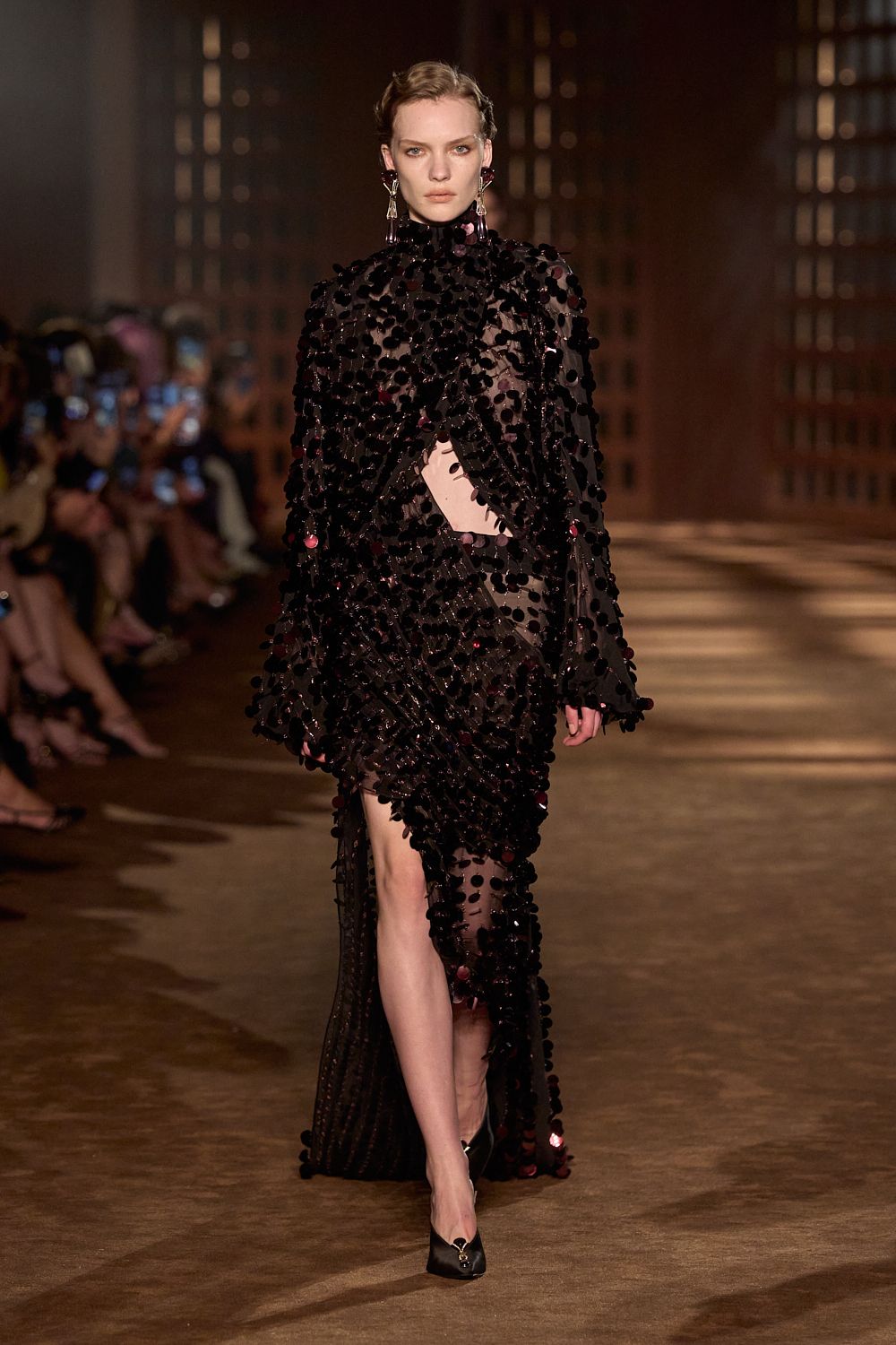 a model walks the ferragamo spring 2027 runway.