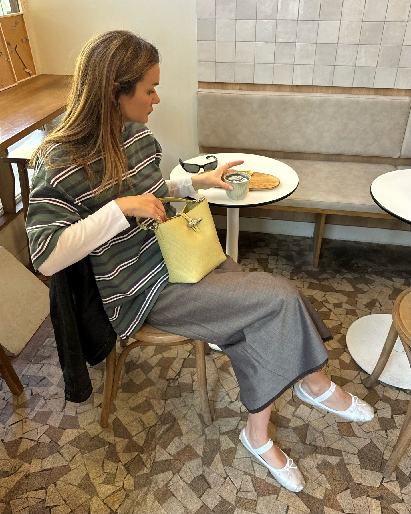 Woman in Paris wearing a fall outfit idea.