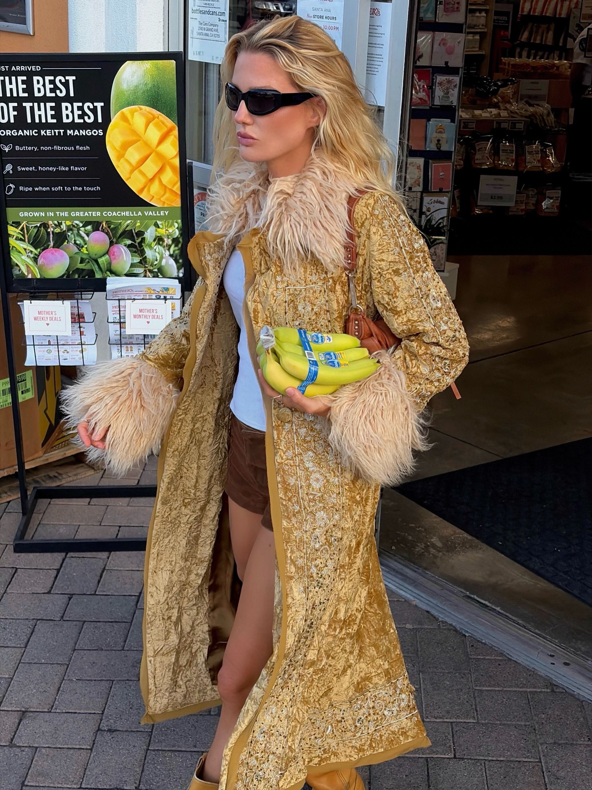 Woman in a gold ornate coat