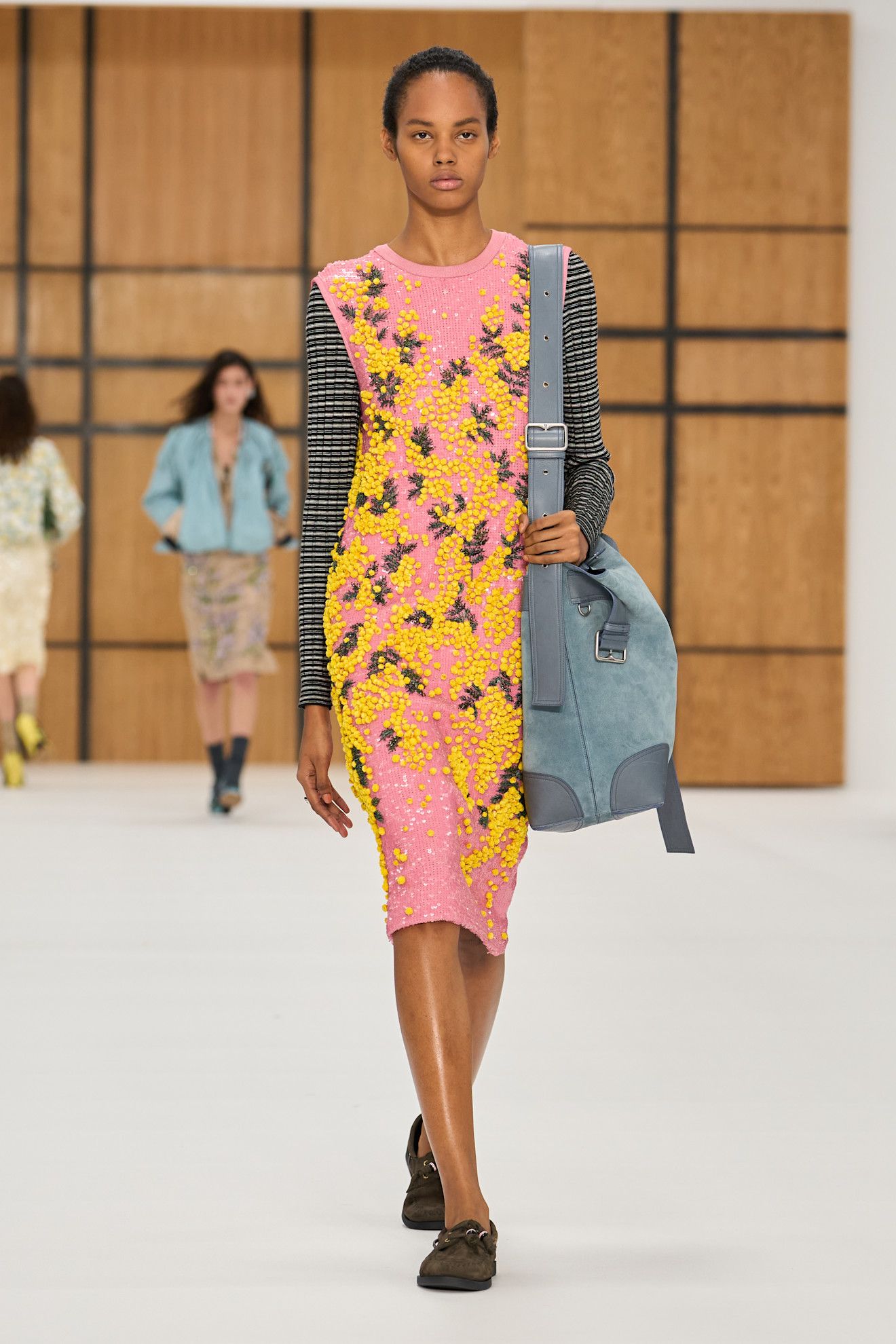 a model walks the burberry runway show.