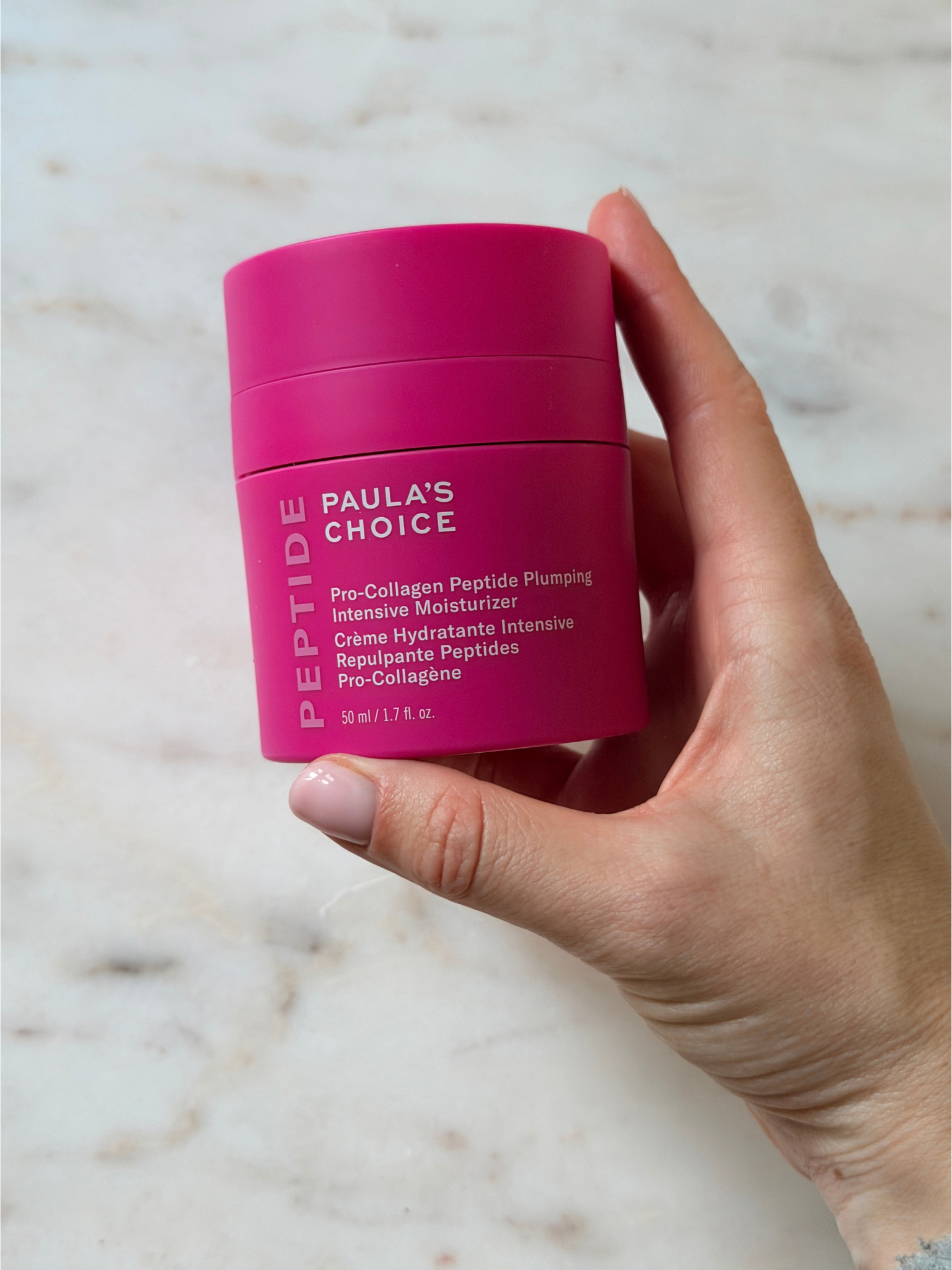 Freelance beauty editor Grace Day holding the Paula's Choice moisturiser