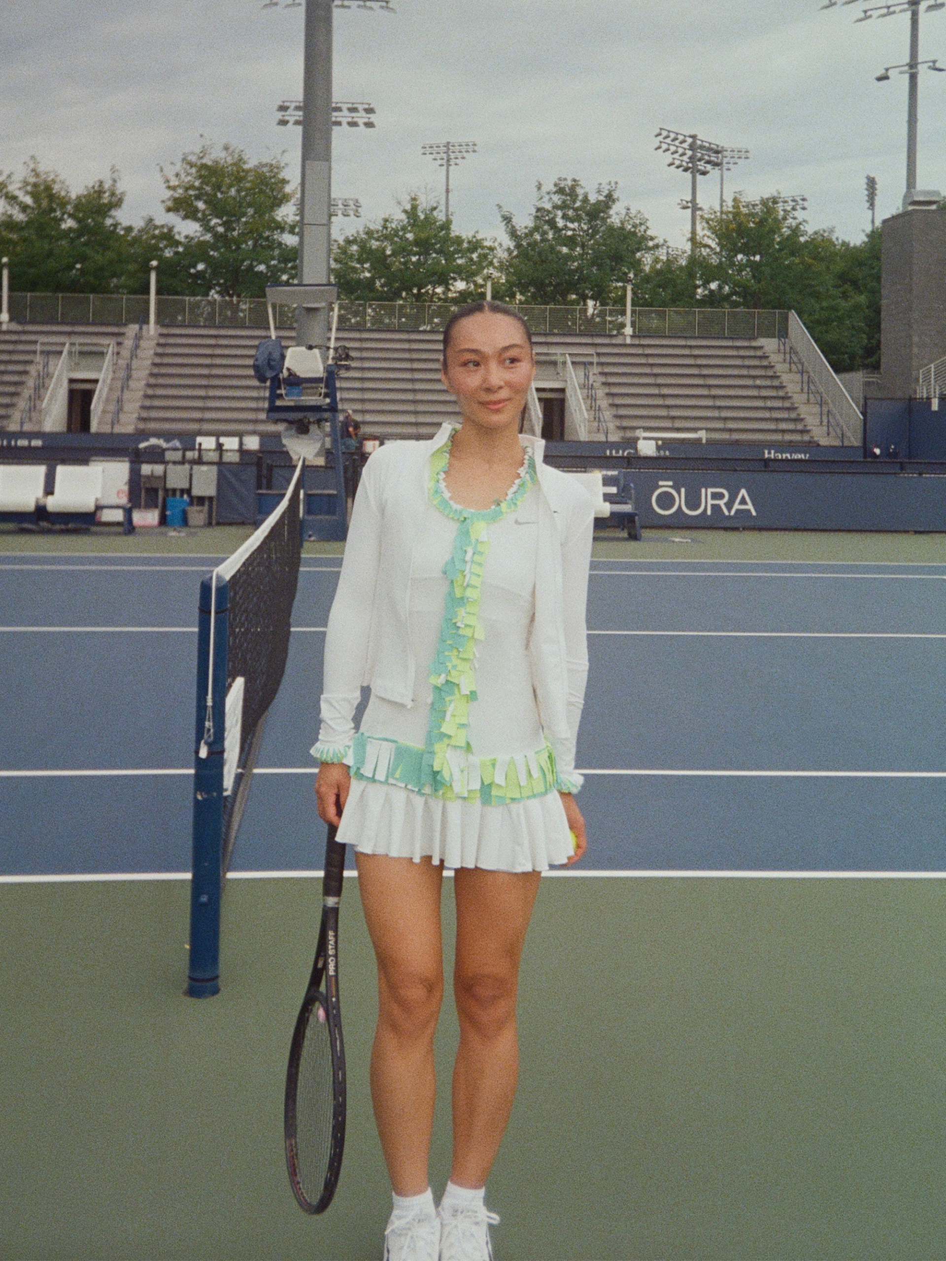 Claudia Li wearing her custom outfit to play in the USTA Pro-Am at the US Open including an upcycled Nike dress and Rolex watch.