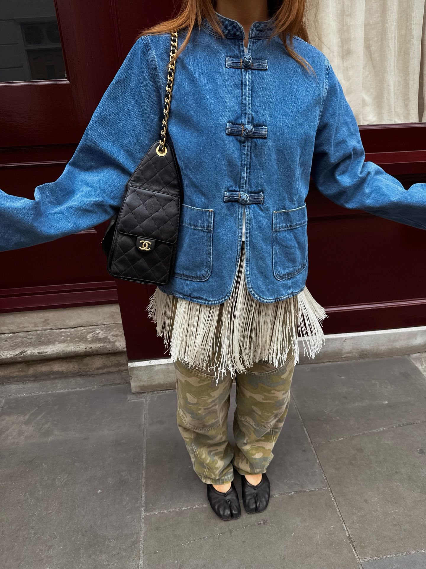 An image of a woman wearing best shoes to wear with camo pants fall 2026