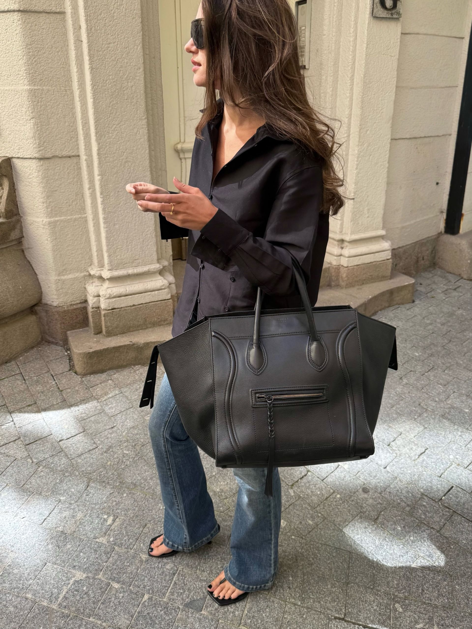 A woman wearing low rise bootcut jeans in 2026.