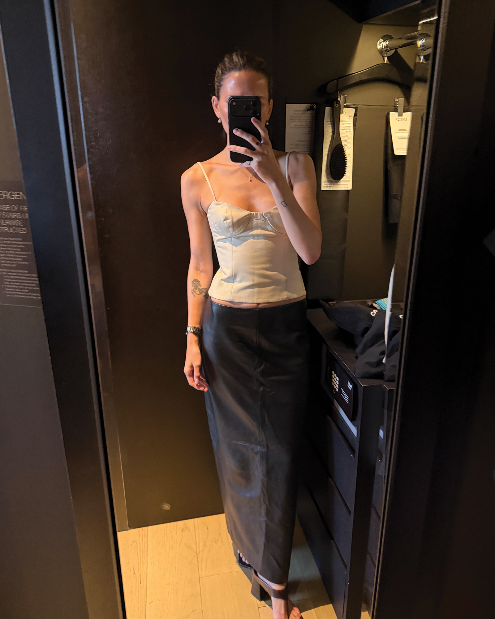 Eliza Huber's outfit for the first night of New York Fashion Week in a mirror selfie taken at the New York Edition.
