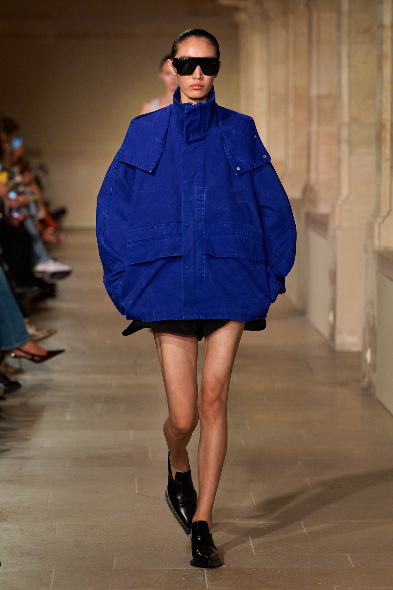 A model walks the catwalk in a cobalt blue jacket for the spring/summer 2026 Victoria Beckham fashion show