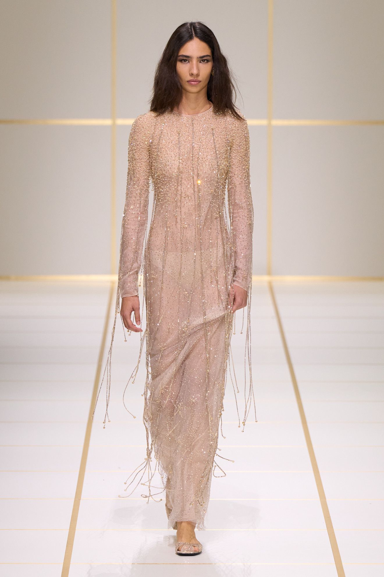 a model walks the giorgio armani s/s 27 runway.