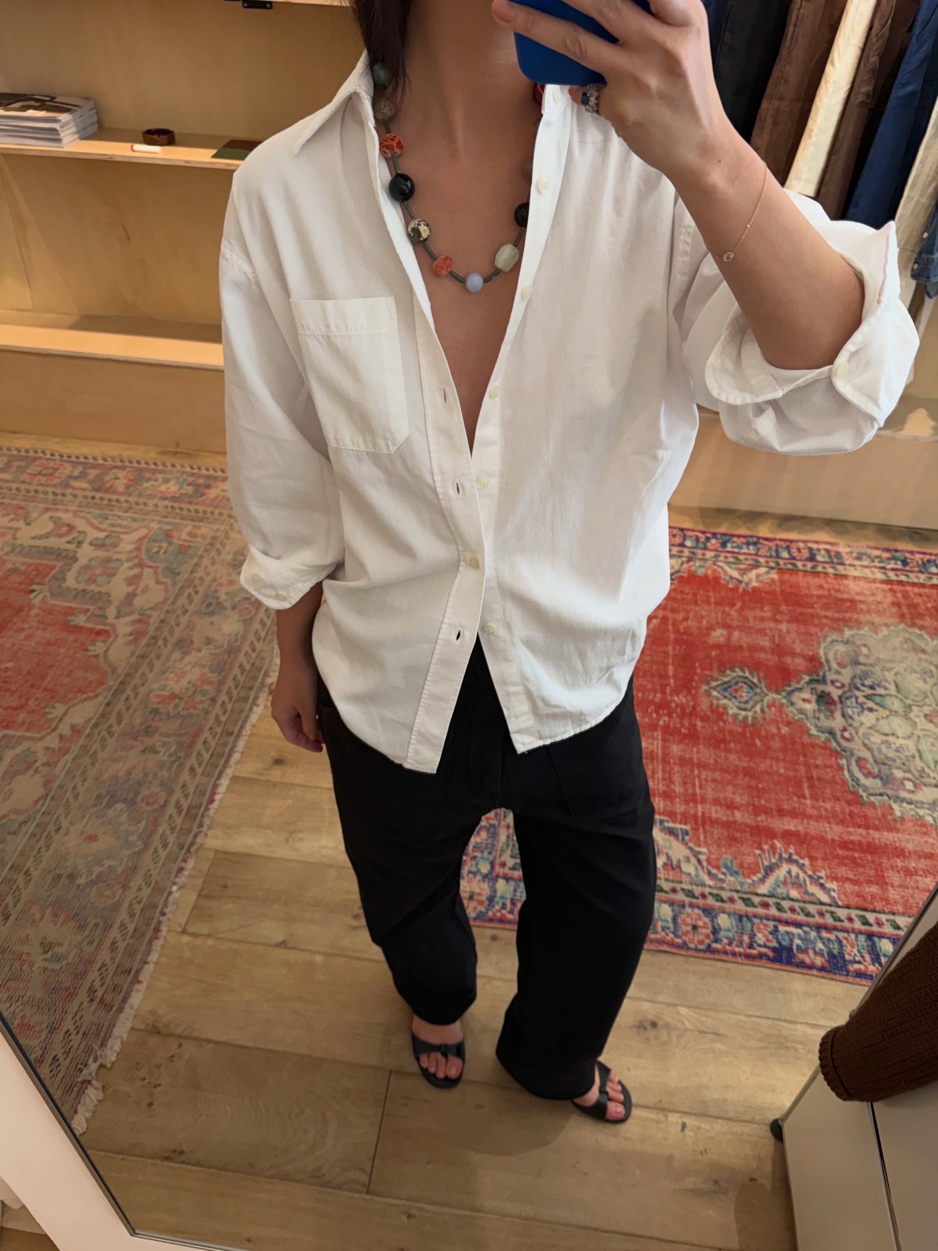 @mimixn wearing a button-down and black trousers.