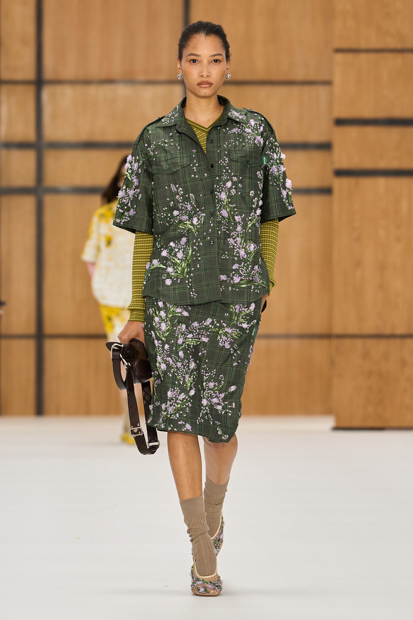 a model walks the spring/summer 2027 burberry runway.